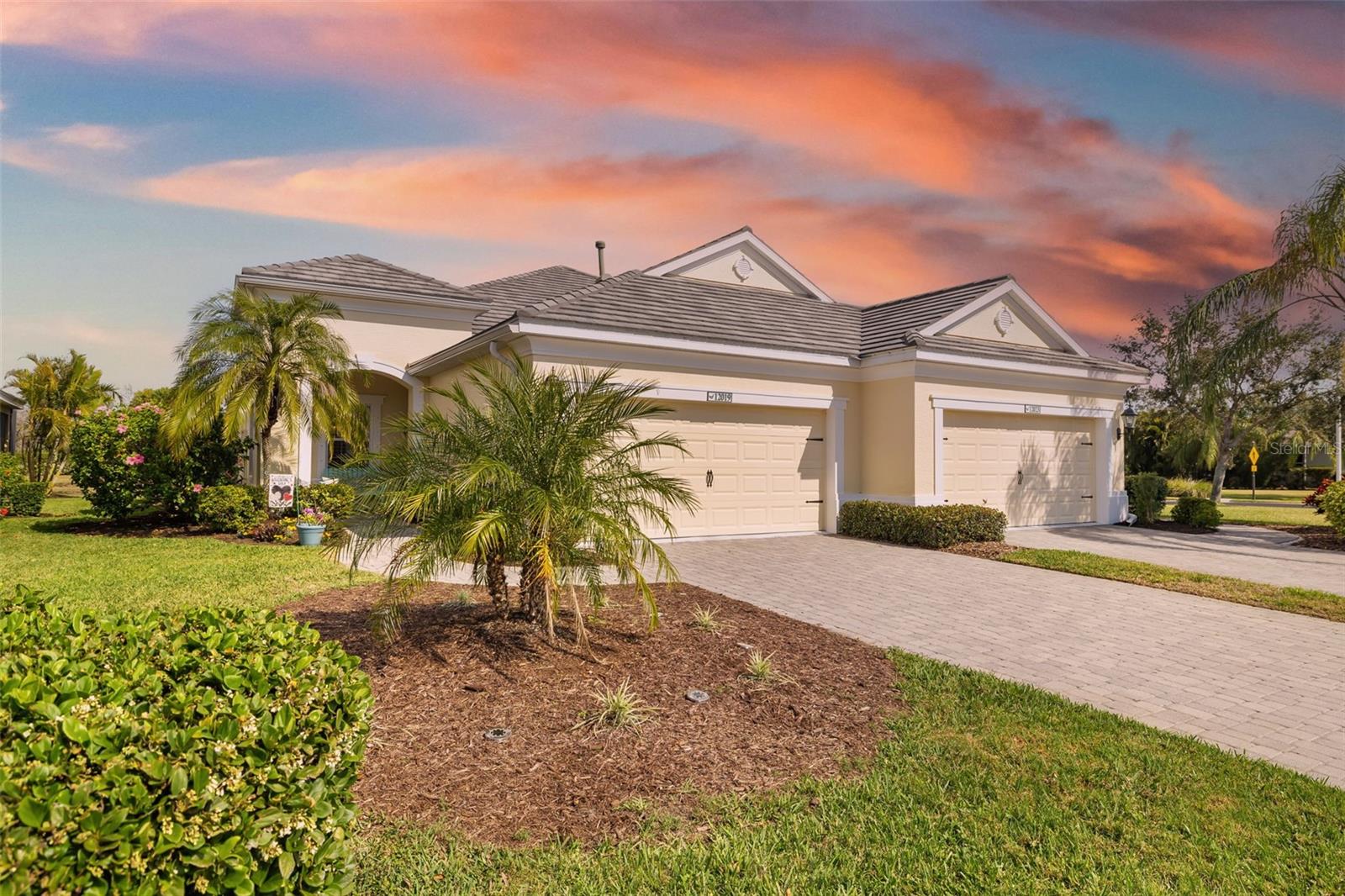 NO CDD FEE! Experience this FURNISHED Top-Level Eagle Trace Villa—this FORMER NEAL BUILT MODEL HOME offers a WATER VIEW and an exceptional living experience! Move-in ready and nestled in a gated community, this home is filled with thoughtful details and high-end finishes. Enjoy recessed lighting in every room and optional architectural trim that adds a refined touch. Elegant, high-quality window treatments perfectly complement the home’s color palette and décor. Love what you see? Furnishings are available for purchase under a separate contract, making your move effortless! The Great Room features a TRAY CEILING with RECESSED LIGHTING, enhancing the spacious feel and inviting natural light. The upgraded kitchen boasts STAINLESS STEEL appliances, GRANITE countertops, and a stylish BACKSPLASH. Cooking is a joy with the gas stove. Step outside through pocket sliders that seamlessly connect indoor and outdoor living. The extended lanai is perfect for grilling, dining, and lounging while soaking in Florida’s sunshine. The split-bedroom floor plan ensures privacy for both you and your guests. Recent updates in 2024 include NEW Carrier Air Conditioner with UV Filter, New Garage Door Opener (roller and springs), Upgraded Lush Landscaping, New Paint in Bedrooms and Dining Room, New GFCI plugs, and newer exterior painting and pressure washing. Enjoy a low-maintenance lifestyle with basic ground maintenance included in the quarterly fee, allowing you more time to relax by the pool and spa. This pet-friendly community even offers two dog parks for your furry friends! Stay active with access to tennis, pickleball, and a playground, all within walking distance. Best of all, there are NO CDD fees! Ideally located near Lakewood Ranch, parks, walking and biking trails, shopping, dining, and world-class beaches, this home offers the best of Florida living. Ready for an easy, enjoyable lifestyle? This is it!