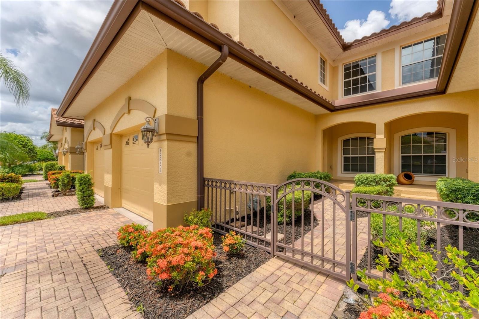 Welcome to this beautifully updated and move-in-ready three-bedroom, two-bath condominium in sought-after Miramar Lagoons neighborhood, in the prestigious Lakewood Ranch Country Club. Designed for comfort, style and low-maintenance living, this second-floor residence offers a spacious layout with an open-concept great room, a bright eat-in kitchen, formal dining room, and a flexible den ideal for a home office or guest space. The renovated kitchen boasts light countertops, modern tile backsplash, stainless steel appliances and plenty of cabinet space. Neutral laminate flooring and white paint throughout create a clean, airy ambiance, complemented by soaring ceilings and abundant natural light. The primary suite is a retreat with a large custom walk-in closet and a luxurious en-suite bath featuring a freestanding soaking tub, glossy tile Roman shower and dual vanities. Two additional bedrooms and an updated guest bath provide plenty of space for family or visitors. Enjoy tranquil, elevated views from the screened lanai or head just a short walk to the community’s amenity center, where resort-style living awaits with a heated pool and spa, ample lounging areas, a cabana and a fully equipped fitness center. This lock-and-leave home includes a convenient attached one-car garage, and the HOA covers all landscaping, irrigation, exterior maintenance and roofing, making ownership effortless. Behind secure gated entrances off Lorraine Road and University Parkway, Miramar Lagoons offers a serene, private setting with monthly rental options, making it ideal for full-time living, seasonal enjoyment or investment. Additional upgrades include updates air-conditioning (2021), water filtration system (2021) and a new tankless water heater (2024). You’re just five minutes from everyday essentials like grocery stores, pharmacies, coffee shops, fine dining and more, everything you need is right around the corner. With quick access to Interstate 75 and just 10 minutes to the UTC Mall, getting to shopping, dining and weekend entertainment is a breeze. And when it’s time to relax, some of Florida’s most beautiful Gulf Coast beaches are only a short drive away. Don’t miss your opportunity to enjoy easy living in Lakewood Ranch’s, America’s #1 best-selling multi-generational community!