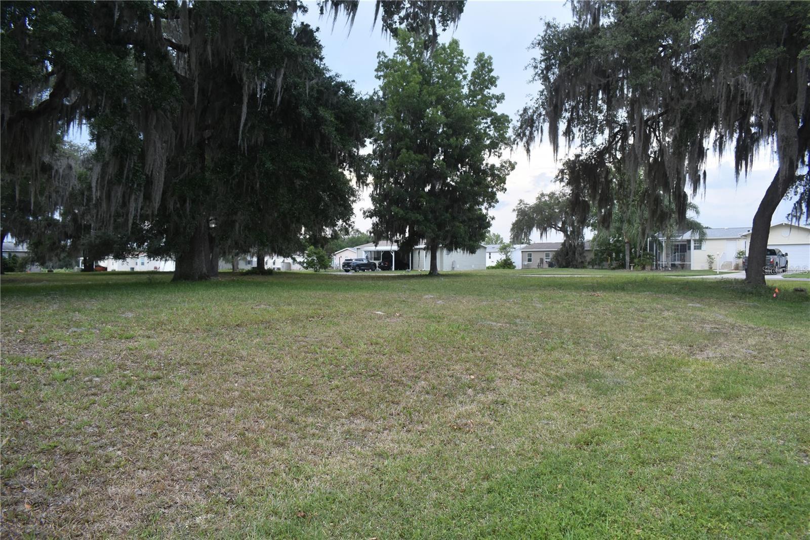 Your Florida Retreat Awaits 55+ Community in Wildwood. Settle into the easy going Florida lifestyle in this welcoming 55+ community, just minutes from Brownwood Town Center in The Villages. Several lots are available, perfect for placing your mobile home and enjoying year-round or seasonal living. (RVs not permitted.) Enjoy quick access to restaurants, shopping, medical offices, and entertainment, with I-75 nearby for day trips to beaches, parks, and attractions across the state. Low monthly HOA of just $75 keeps things affordable, and turn-key placement options are available to make the move-in process smooth and stress-free. A quiet, convenient location with everything you need close by your next chapter starts here.