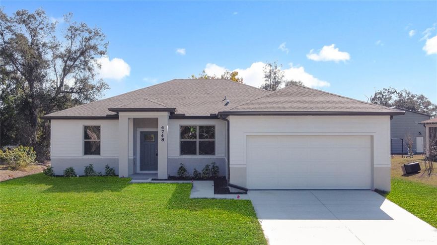 Excellent price with luxury features and move-in ready! A brand new home with city water and septic system in North Port – no HOA fees! Great location! Ideally located for quick access to Highway 41, shopping, schools, medical facilities, Warm Springs Park, and the Aquatic Park. This affordable new home is ready for you and is just what you've been looking for... No HOA fees and city water! This home features 9-foot ceilings, a spacious and open layout with a versatile floor plan. The home has 4 bedrooms, 2 full bathrooms, a formal dining room, a living room, an open kitchen, and a two-car garage, with 1,810 square feet of living space. The living space is well-utilized, with high ceilings and numerous windows providing natural light. The interior finishes will provide you with the quality and luxury you were looking for in your new home. This home has a split floor plan, with the primary suite on one side and the guest bedrooms on the other. The primary bedroom has tray ceiling and large windows allowing for plenty of natural light. You will also enjoy a spa-like bathroom with a spacious walk-in shower with floor-to-ceiling tiled walls and a glass enclosure. It also features a linen closet, a double vanity, and a large walk-in closet. The living room has large windows and several LED light fixtures providing ample light, with access to the covered lanai. The living room is open to the kitchen, where you will find a large center island with additional seating for casual dining and plenty of cabinetry. The kitchen features stainless steel appliances, Shaker-style cabinets with crown molding , decorative hardware, a subway tile backsplash, and granite countertops. The dining room is located at the front of the house, with large windows allowing for abundant natural light. The home includes luxury vinyl plank flooring in the main living areas and bathrooms for durability and comfort. You'll love these floors! They are easy to maintain and offer a modern design, perfect for new homes. Other features include the same beautiful Shaker-style cabinets with hardware and granite countertops in the bathrooms, 5-inch baseboards, a garage door opener, exterior gutters, R38 insulation, a 16 SEER HVAC system, and much more. Visit our showroom and compare the features and quality to other homes, and you'll see the difference. We make buying easy for you! The photos and videos are the same floor plan, but different location.