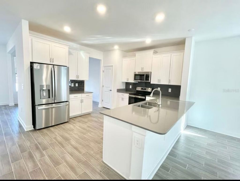 Photo of 11478 Listening Drive, Orlando, FL 32832 (MLS # O6409736)