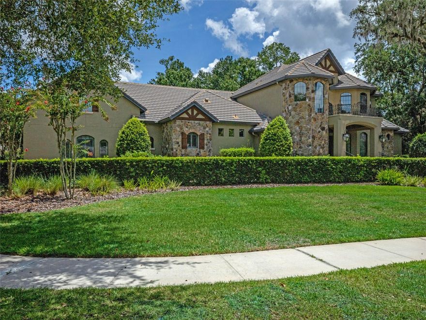 First time on the market in Alaqua Lakes! Water and golf views! This is a custom-built home you will not want to miss! Four bedrooms (all en suite), two bonus rooms both with their own full bath, and a dedicated office! The fully paved circle drive with extended parking pad on garage side will provide ample parking for your guests! The fully pocketing enormous sliders open to a backyard oasis as unique as the real flagstone and Chicago brick you will find throughout. Half the pool is under screen, and the other half is outside. There is a beautiful summer kitchen with natural gas grill and bar to please the most discriminating entertainer. The kitchen is a chef’s delight with an enormous island with ample storage in addition to a GE Monogram suite of appliances. The walk-in pantry is huge and houses an additional full-size refrigerator. 168-bottle, temperature-controlled walk-in wine cellar with additional case storage and seating. Indoor and outdoor fireplaces. This is the home for the lifestyle you have wanted and was built with quality in mind everywhere you look. Alaqua Lakes residents enjoy a 7-acre community park with tennis courts, beach volleyball, soccer and basketball! There is truly too much to list.