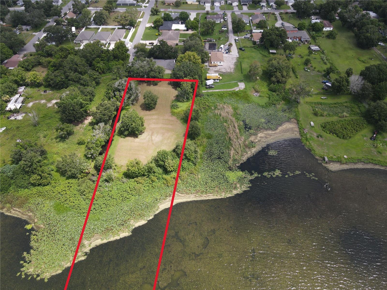 Welcome to a rare and remarkable opportunity to own nearly 2 acres of lakefront property on the serene shores of Lake Mann, just minutes from the heart of downtown Orlando. Whether you’re a custom home builder, an investor, or someone ready to build the waterfront estate of your dreams, this expansive parcel offers unlimited potential.
This oversized lot boasts breathtaking views of Lake Mann, providing the perfect backdrop for a private retreat or luxurious primary residence. With direct lake access, you’ll enjoy peaceful sunrises, fishing, kayaking, boating, or simply relaxing by the water in your own backyard oasis. The size and layout of the lot has flexibility for a variety of building options—including a main home, guest house, outdoor entertainment spaces, and more.
Situated in a well-established area, this property is ideally located just a short drive to downtown Orlando, major highways (I-4, 408), Camping World Stadium, and local shops and restaurants. It’s the perfect blend of natural beauty and urban convenience.
Large lakefront lots this close to the city are incredibly rare—don’t miss this chance to secure your piece of lakefront paradise and bring your vision to life. Whether you're planning to build now or hold for future development, this is a prime piece of real estate with endless possibilities.