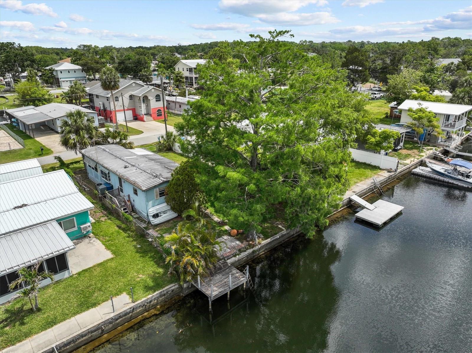 Investor Special – Waterfront Opportunity on the Weeki Wachee River Canal!
Unlock the potential of this 1-bedroom, 1-bathroom home located in the heart of Weeki Wachee Gardens! Damaged during Hurricane Helene, this property presents a rare investment opportunity—whether you're looking to renovate, elevate, or rebuild from the ground up, this is your chance to bring your vision to life.
Enjoy 50 feet of direct canal frontage just minutes from the Weeki Wachee River and Gulf of Mexico access with no fixed bridges. Fish for redfish, snook, or snapper right from your backyard, or relax and watch manatees and dolphins glide by in this serene, spring-fed waterway.
This Gulf Coast fishing retreat is being sold As-Is, Where-Is, and How-Is. The seller retains rights to any insurance or other damage-related payouts. Buyers are responsible for all due diligence, including inspections and verification of all information.
Located just an hour north of Tampa via the Suncoast Parkway, Weeki Wachee Gardens is a hidden gem tucked away from the busy highways, offering a true taste of Old Florida. With crystal-clear spring-fed waters, a constant 74-degree river, and easy access to world-class boating, fishing, diving, and manatee encounters, this community is beloved for its natural beauty and outdoor lifestyle.
Don't miss this chance to invest in one of Hernando County’s most charming waterfront communities. Whether you're a seasoned investor or a visionary homeowner, the possibilities here are endless!