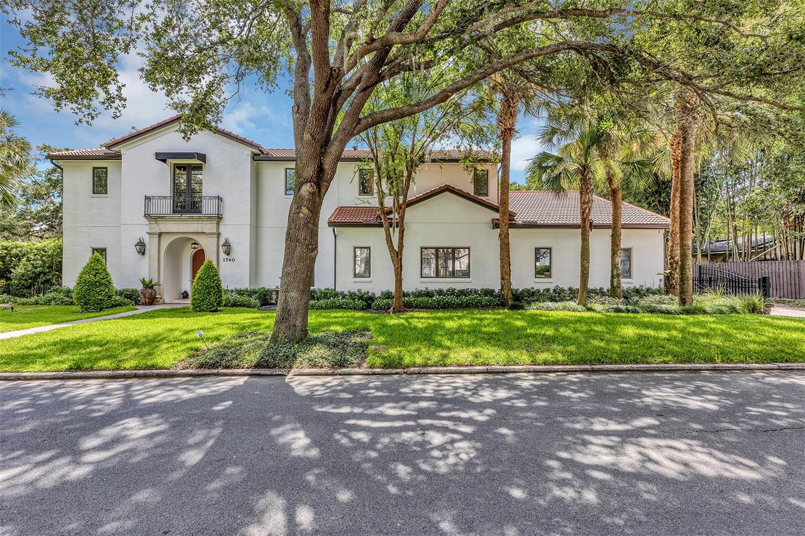 Welcome home to this Phil Kean designed home in the heart of a beautiful Winter Park neighborhood! This elegant residence offers an unmatched blend of style, sophistication, and tranquility. Located on an oversize corner lot (.32 acre), this gem features 5 spacious bedrooms and 5 1/2 bathrooms. As you step into the foyer, you’ll be captivated by the high ceilings custom wrought iron banister and Italian marble floors. Beyond the foyer, a tropical paradise awaits. Revel in the serenity of your private, screened & heated saltwater pool oasis, beautifully accented with brick pavers and a cozy gas fire pit – an entertainer's dream! Whether it's a summer pool party or a relaxing winter night by the fire, this backyard has got you covered. The gourmet kitchen is complete with Viking stainless steel appliances, custom wood cabinets and an island breakfast bar. On the second floor, three generously proportioned bedrooms each with private bathrooms and walk-in closets, assure privacy and convenience for all family members. The Master suite on the first floor enjoys a brand new, luxurious bath, providing the ultimate retreat. Key features also include a robust whole-house generator ensuring continuous power supply, a comprehensive water softening system, wired sound system and CCVT throughout the house, newly installed tankless water heater, wifi-capable shower controller in master bathroom, and a newly installed roof (2022). The family room is particularly striking with an exquisite, curved window wall, adding an artistic touch to the contemporary design. Location is everything and this home has it all! Walking distance to Park Avenue and nestled within the top-rated school districts – Dommerich Elementary, Maitland Middle & Winter Park High – education and entertainment are at your fingertips. Don't let this exceptional opportunity slip away! Schedule your tour today and step into a world of refined living.