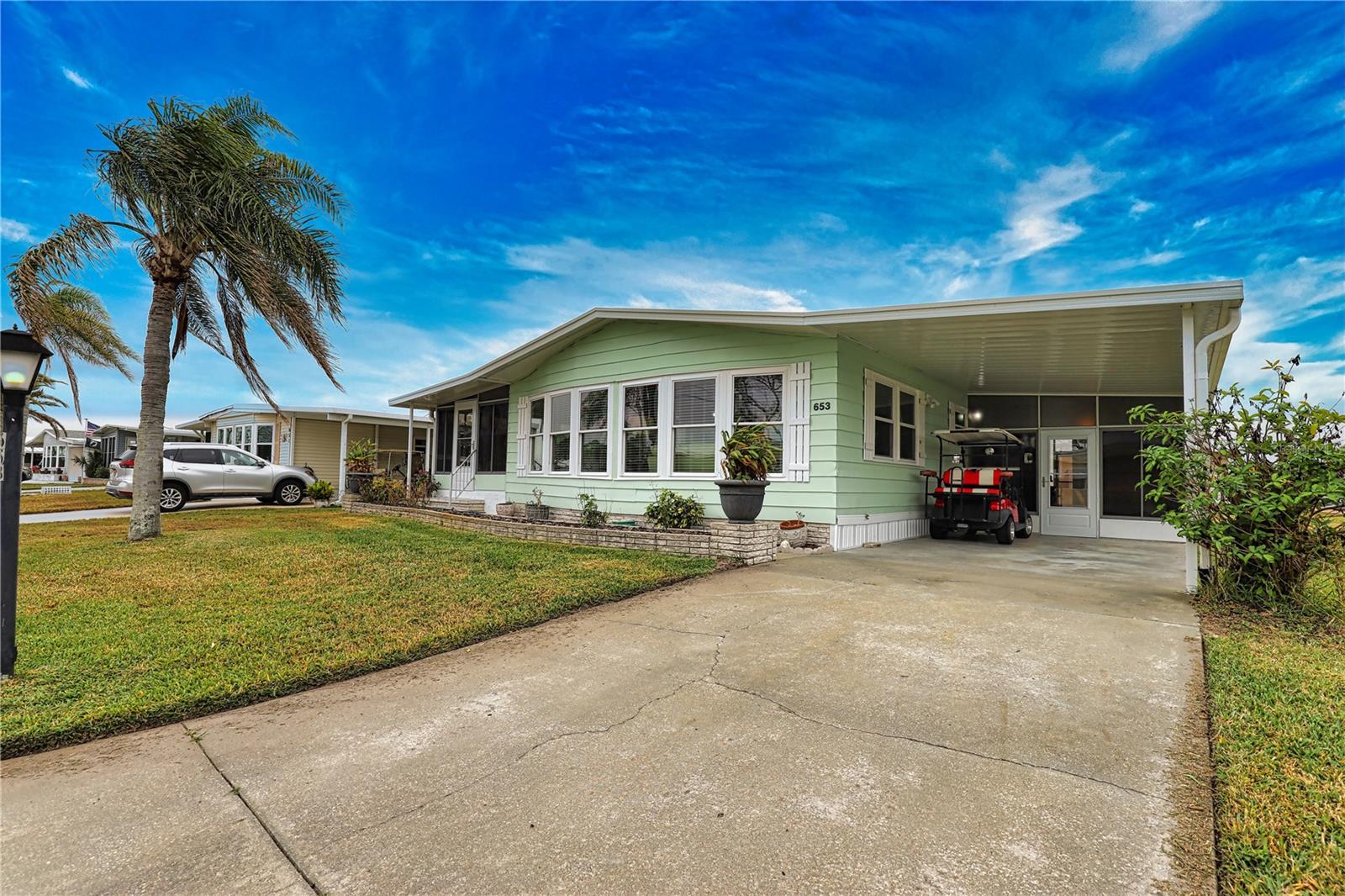 You’ll be enchanted by this home and never want to leave! The updated eat-in kitchen boasts 3 pantries and lots of cabinets. The dining room/living room combination is spacious with a wall of windows for plenty of natural light. This opens to a large Florida Room for additional
living/entertaining space. The primary bedroom is extremely spacious with a wall of built-in drawers and an ensuite bathroom with a walk-in shower and a separate vanity area that has a walk-in closet. The guest bedroom has built-in drawers and a large walk-in closet. The guest
bath has a walk-in shower. A/C 2024. Culligan Water Softener. Reverse Osmosis Water System in Kitchen. New Windows 2020. Home is being offered furnished and Golf Car is included.
La Casa boasts 974 homes nestled among a variety of native trees with spacious common grounds surrounding our eight lakes. Our lots average a generous 60' by 80'. The ultimate lifestyle on Florida’s Gulf Coast is located between Sarasota and Fort Myers and is a boater's dream with access to the Gulf of Mexico. It is convenient for shopping, sightseeing, golfing, fishing, and boating, as well as all the culture and elegance the Southwest Florida area is noted for. Residents and visitors enjoy the warmth of Southwest Florida winters in a relaxed and unhurried environment far removed from the hustle of Florida’s east coast. You’ll be surrounded by mature lush landscaping which demonstrates the utmost level of care our property receives from residents and management. La Casa may have the best pools in the area. Our crown jewel is an extremely large, 40 X 60-foot swimming pool that is kept at a perfect 87 degrees. Our smaller 20 x 40 pool is quietly nestled between the clubhouse and the Activity Building. Both pools have adjacent hot tubs which are ideal for soaking muscles that are tired from golfing or tennis. Wireless Internet (Wi-Fi) is available at the Clubhouse, Activity Building, and Recreation Hall area where these pools & spas are located, so you can catch some rays while you catch up on your email! Sound enticing? La Casa is a friendly, family community. You will be away from the hustle and bustle except when you want to be part of it. Come for a visit to this self-contained oasis and see for yourself why La Casa is the ultimate destination for both snowbirds and year-round residents!