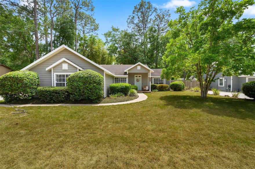 Charming and move-in ready, this beautifully updated 3-bedroom, 2-bath home offers quality craftsmanship by reputable builder Robinshore and a thoughtfully designed split floor plan, all nestled in the highly sought-after Cherrytree neighborhood. Step inside to find tile flooring throughout the main living areas and guest bedrooms with cozy carpet in the spacious primary suite. The fully renovated kitchen is a true highlight, featuring quartz countertops, solid wood cabinetry, and stainless steel appliances—perfect for both everyday living and entertaining. The inviting living and dining areas are centered around a dual-sided wood-burning fireplace, creating a warm and welcoming ambiance from both spaces. The primary suite includes a walk-in closet, dual vanities, and a private bath for added comfort. Enjoy Florida living at its best with a screened-in back porch and a backyard featuring pavered areas—ideal for relaxing or hosting gatherings. Additional features include a fully fenced yard, a 2-car garage, and peace of mind with a 4-year-old water heater and new HVAC condenser unit in 2023. Conveniently located in NW Gainesville, this home is just minutes from Publix, popular restaurants, and less than 10 minutes to the University of Florida and Shands Hospital, offering the perfect balance of comfort and convenience. Don’t miss your opportunity to own this beautifully updated home in one of NW Gainesville’s most desirable neighborhoods—schedule your private showing today!