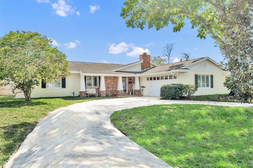 Set on one of the most sought-after streets in Dommerich, this completely renovated home combines the solid construction of a 1963 block home with thoughtful modern updates throughout. From the moment you arrive, the circular driveway, classic brick accents, and welcoming front porch set the tone. Inside, a bright foyer opens to beautiful solid maple wood floors and a light, airy feel that carries throughout the home. To the right, the formal living room features built-in shelving and a striking brick wood-burning fireplace, while the adjoining formal dining room connects directly to the kitchen and can be closed off with pocket doors if you want a little separation. The eat-in kitchen is truly the heart of the home, showcasing rich solid cherry cabinetry, unique man-made glass countertops, a large farmhouse sink, and top-of-the-line stainless Bosch appliances including a built-in oven and gas cooktop. A generous peninsula overlooks the oversized family room, where French doors open to a stunning Florida room that fills the home with natural light. This space is a showstopper—large, lined with windows, and finished with soaring shiplap ceilings—creating the kind of room you’ll use year-round, with direct access to the backyard. The primary suite is spacious and refined with crown molding, a built-in closet plus a walk-in, and a beautifully renovated bath featuring matching glass countertops, a Kohler vanity, and a glass shower with both a large rain head and handheld fixture. Two additional bedrooms are generously sized and share an updated hall bath with a large vanity, classic subway tile, and a soaking tub. The interior also includes a well-equipped laundry room with cabinetry, a cedar storage closet, and access to the two-car garage. Out back, the fully fenced private yard offers plenty of room for entertainment, recently re-sodded with irrigation and enclosed with a brand new wood fence installed in 2025—leaving ample space for a future pool or patio if desired. Additional upgrades include smooth flat ceilings with recessed lighting throughout, new drywall, plantation shutters, updated windows and doors, and an energy-efficient hybrid water heater. Beyond the home itself, the location is hard to beat—just a short walk to Dommerich Elementary, Maitland Middle School, and Maitland Community Park offering tennis courts, indoor racquetball, and playgrounds. Zoned for highly regarded Winter Park High School. Call today to schedule your private showing!