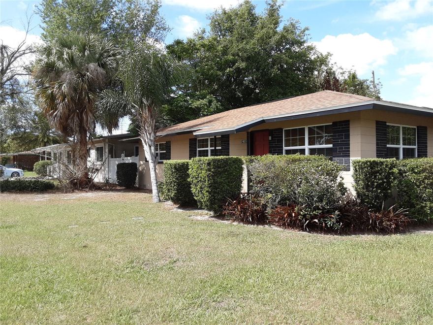 Solid Block home on corner lot with large 2 car garage AND a carport! With thermal pane windows and, new AC in 20222 your bills will be low and you will be comfortable in this 3 bed 2 bath home with 3 living spaces. The flow is designed to keep proximal to your family/guests, yet have defined spaces if needed. Cozy eat in kitchen with plenty of cabinet space, newer wall oven and cooktop, granite counters, light and trendy glass block backsplash. Remodeled/renovated bathrooms boast tile in the master bath, custom design, with lights in both showers.   Original beautiful floors. Huge corner lot! 2 Car garage plus carport. Small shop/storage shed with workbench, electricity, outside lighting with motion sensors. Most of home has original hardwood floors. Adjacent dining area and living areas open up to a lovely room with stone tile, a windowed wall which is fully permitted.  This home is clean and move in ready, Kaley-Lake Como K-8, Boone High. Make your dream come true with this one. Tenant occupied until 7/31/2026. Call now to purchase a great opportunity!