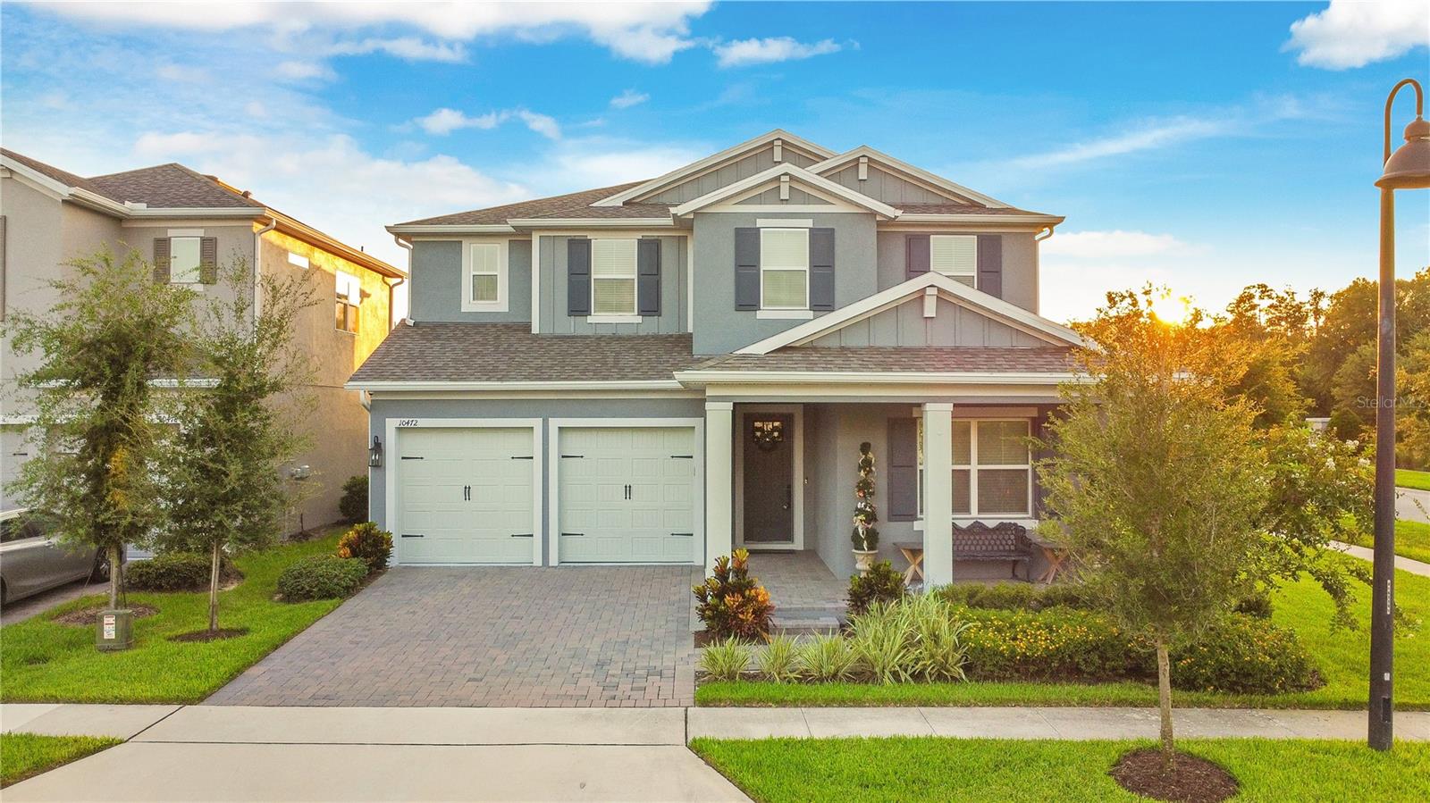 Now available for RENT, FOR SALE OR with a LEASE-PURCHASE OPTION. With nightly views of the Disney fireworks and access to top-rated schools, this is more than just a home — it’s a lifestyle you’ll love coming home to. Welcome to 10472 Petrillo Way, located in the serene Winding Bay Preserve community of Winter Garden. This stunning K. Hovnanian Grayson Model home, built in 2022, and offers the perfect blend of elegance, comfort, and convenience. Situated on a premier corner lot, this 5-bedroom, 6-bathroom home features over 4,000 square feet of thoughtfully designed living space. The gourmet kitchen is a true standout, equipped with GE Profile appliances, granite countertops, custom soft-close cabinetry, under-cabinet lighting, a designer hood vent, and a spacious walk-in pantry. The open floor plan seamlessly connects the kitchen to the living and dining areas, ideal for entertaining and everyday living. Throughout the home, you’ll find luxury vinyl plank flooring downstairs, engineered hardwood in the upstairs common areas, crown molding, tray ceilings, a speaker system, and unique ceiling fans sourced from Disney properties such as the Grand Floridian and Wilderness Lodge. The first-floor primary suite is a private retreat with motorized blackout shades, a freestanding tub, dual vanities, a custom frameless glass shower, and a large walk-in closet with pool views. A second bedroom with an ensuite is also located on the main floor, perfect for guests or multi-generational living, along with a dedicated office space enclosed by French doors. Upstairs, enjoy a spacious loft, a media/theater room pre-wired for surround sound, and three additional bedrooms, each with walk-in closets and access to private bathrooms. Outside, the backyard is a private oasis featuring a custom heated saltwater pool and spa with smart controls, a screened lanai, and a fully fenced yard with tranquil pond views. Additional features include a charming front porch, a comprehensive security system, and access to community amenities like a pool, dog park and playground. Conveniently located near Disney, Hamlin, Flamingo Crossings, and major highways, this home is zoned for top-rated schools and even offers NIGHTLY VIEWS OF DISNEY FIREWORKS from the upstairs front bedroom. This exceptional home offers a rare opportunity to enjoy the best of Florida living in a highly desirable location. Contact us today to schedule your private showing. Now available for RENT, FOR SALE OR with a LEASE-PURCHASE OPTION.
