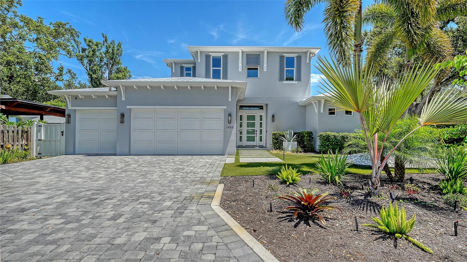 LOCATION, LOCATION, LOCATION. Stunning turnkey furnished single family home available to rent in the sought after community of Poinsettia Park of Sarasota. This West of the Trail, 2020 build, Classic Homes by Clayton Inc., property is energy-efficient, elegant, beautifully furnished, and well appointed. Pulling up to the home you immediately notice the professional landscaping and lighting with Florida friendly plantings, paver driveway and welcoming front entry. Opening the front door, you’re greeted with floor to ceiling wall-to-wall sliders, engineered hard wood floors, high ceilings, open concept and views to the pool and outdoor living space. The gourmet kitchen has stainless appliances including Wolf double oven and stove top, Bosch dishwasher and Sub Zero built in double door refrigerator freezer with cabinet overlay, large island with seating for four and cabinet storage on both sides and plenty of counter and cabinet space. Open living/dining space with seamless transition for all indoor/outdoor entertaining. Outdoor area provides covered living/dining/grill area with sink/refrigeration/gas fire place with door to full pool bath. Enjoy outdoor tv, heated pool, spa, sun shelf and two elevated gas fire accompaniments. Back inside the home has two stories, four bedrooms and four bathrooms. The first floor primary suite has a king sized bed, two oversized walk in closets and an en suite bathroom with marble tile floors and surrounds, soaking tub, walk in shower with multiple shower heads, double sinks, stone counter tops and water closet. The first floor guest bedroom is located on opposites of the primary bedroom with optimal privacy and is furnished with a queen sized bed. The first floor guest bedroom offers a stall shower and direct access to the pool/outdoor living space. The second floor has a family room with wet bar and two guest bedroom suites. One of the two upstairs bedrooms has a queen sized bed and the other a king sized bed. The home also has a laundry room with full sized washer and dryer and utility sink and a three car garage. Furnished for upscale living with high end furniture and luxurious linens. Living here has you located minutes from Southside Village Shops, Morton’s Market, Downtown Sarasota, Shelby Garden’s, the Bayfront, theaters as well as St. Armand’s Circle, Lido Key, Siesta Key and much, much more. Available asap for an annual rental. This exquisite home is not one to miss so call today to schedule your private showing.