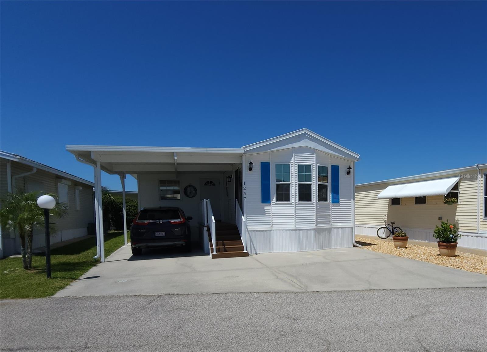 WELL KEPT ONE BEDROOM, TWO BATHROOM MOBILE HOME IN ACTIVE 55+ COMMUNITY. This turnkey property is in move-in condition. Eat-in kitchen. Single carport. Storage shed. Den with an en suite full bathroom and a separate entrance could easily become a second bedroom. Light and beachy decor. Central A/C (2020). New membrane roof (2025). Water heater (2021). Sold for CASH ONLY. Sugar Creek Country Club has LOW HOA FEES OF $525 each QUARTER which include internet, cable, grass mowing, water, sewer and trash. There are 2 swimming pools, heated spa, clubhouse, tennis, pickleball, shuffleboard, a fitness room, and workshop. There is an active social calendar during the winter months. Enjoy this community's proximity to the River Links Golf Course and the Braden River. SO MUCH TO OFFER! Sorry this is not a dog lot.
