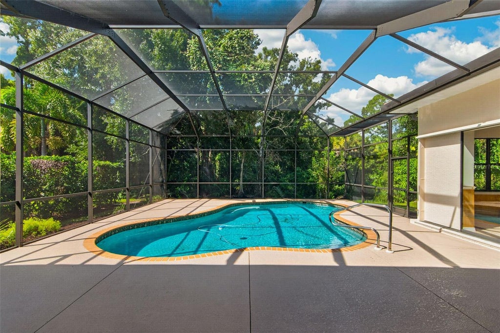 Photo of 679 Sawgrass Bridge Road, Venice, FL 34292 (MLS # TB8551622)