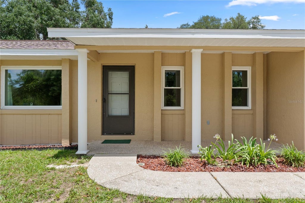 Photo of 9390 E Windwood Loop, Inverness, FL 34450 (MLS # OM730726)