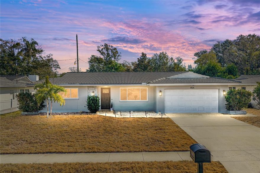 Welcome to your slice of Florida living in the heart of Clearwater. This beautifully updated 2-bedroom, 2-bath, 2-car garage home offers the perfect blend of modern upgrades, functional comfort, and laid-back lifestyle appeal, all within a well-established residential setting.

From the moment you arrive, the curb presence is clean and inviting, highlighted by a durable concrete tile roof and fresh exterior paint. Step inside to discover a bright, open interior enhanced by continuous luxury vinyl plank flooring that flows seamlessly throughout the home, creating both visual cohesion and everyday durability. For buyers who appreciate vintage charm, original terrazzo flooring remains preserved beneath, offering a unique design option.

The renovated kitchen serves as the centerpiece of the home, featuring quartz countertops, updated cabinetry, newer appliances, and generous prep space that opens naturally into the main living and dining areas. Whether hosting friends or enjoying a quiet evening in, the layout supports both entertaining and day-to-day living.

Both bathrooms have been tastefully remodeled with matching quartz surfaces and modern finishes, delivering a clean, move-in-ready feel. Fresh interior paint, applied in a double coat of Sherwin-Williams Emerald, enhances the natural light and adds to the home’s polished presentation.

Peace of mind comes from a series of significant system upgrades, including hurricane-impact PGT windows and doors installed in 2023, a concrete tile roof supported by a clean 4-point inspection, and a newly installed flat roof over the sunroom that carries a transferable warranty. A newer appliance package further complements the home’s updated condition.

One of the home’s standout lifestyle features is the sunroom, offering flexible space for a second living area, dining nook, playroom, or home office. It opens to a covered rear patio and fully fenced backyard, ideal for outdoor lounging, grilling, or simply enjoying Florida’s year-round sunshine. The property backs to a natural waterway and greenery, creating a private, tranquil backdrop.

Situated in a central Clearwater location, the home places you minutes from everyday conveniences and local attractions including shopping and dining, golf courses, walking trails and world famous Clearwater Beach.