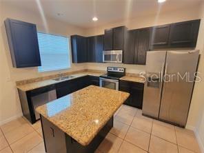 Photo of 9571 Silver Buttonwood Street, Orlando, FL 32832 (MLS # O6419529)