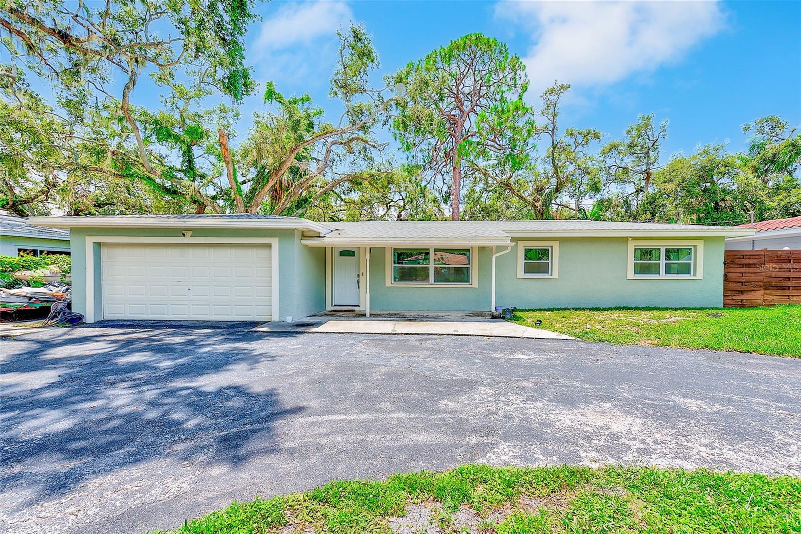 Impressive Renovated 4-Bedroom, 2-Bath Home with Expanded Living Space in Bay Pines Estates – No Flood Insurance Required
Welcome to this beautifully upgraded 4-bedroom, 2-bath, 2-car garage block home in the highly desirable Bay Pines Estates community. Originally remodeled six years ago with a down-to-the-studs renovation, this home continues to shine with thoughtful improvements, quality craftsmanship, and pride of ownership throughout.
The major remodel (6 years ago) included a new roof, upgraded ductwork, energy-efficient windows, updated electrical, modern bathrooms, luxury tile and carpet, LED lighting, stylish kitchen cabinetry with granite countertops, and a full suite of stainless steel appliances. More recent enhancements include a new water softener, backyard French drains for improved drainage, and the conversion of the original patio into 500 sq ft of additional living space—ideal for a family room, playroom, or flex space to suit your lifestyle.
The open-concept layout features a spacious kitchen and living room combination flooded with natural light from multiple glass doors leading to the private courtyard. The chef’s kitchen boasts white, solid wood cabinetry, granite counters, ample prep space, and stainless steel appliances—perfect for hosting or daily family meals.
Enjoy a smart split floor plan with three bedrooms on one side of the home and the primary suite privately located on the other. The master bedroom offers a generous walk-in closet, an ensuite bath with double vanity, soaking tub, and separate shower, plus French doors that open directly to the serene courtyard patio.
Designed with indoor-outdoor living in mind, nearly every main room—including the living room, hallway bath, and three of the four bedrooms—connects to the private courtyard, creating a peaceful, open-air retreat ideal for relaxing or entertaining.
Additional features include a spacious 2-car garage, an oversized circular driveway for ample parking, and generous storage throughout. The fully fenced backyard enhances both privacy and peace of mind.
Set in a vibrant neighborhood known for its charm and community feel, you're just minutes from world-famous Gulf beaches, top-rated schools, and a wide variety of dining, shopping, and entertainment. Convenient access to the Pinellas Trail, local parks, Walmart Shopping Center (with Starbucks), Texas Roadhouse, KOA campground, public boat ramps, and both Tyrone Square and Seminole City Center malls add to the appeal.
Best of all—No Flood Insurance Required!
Don't miss this opportunity to own a meticulously maintained and spacious home in one of Pinellas County’s most sought-after locations.