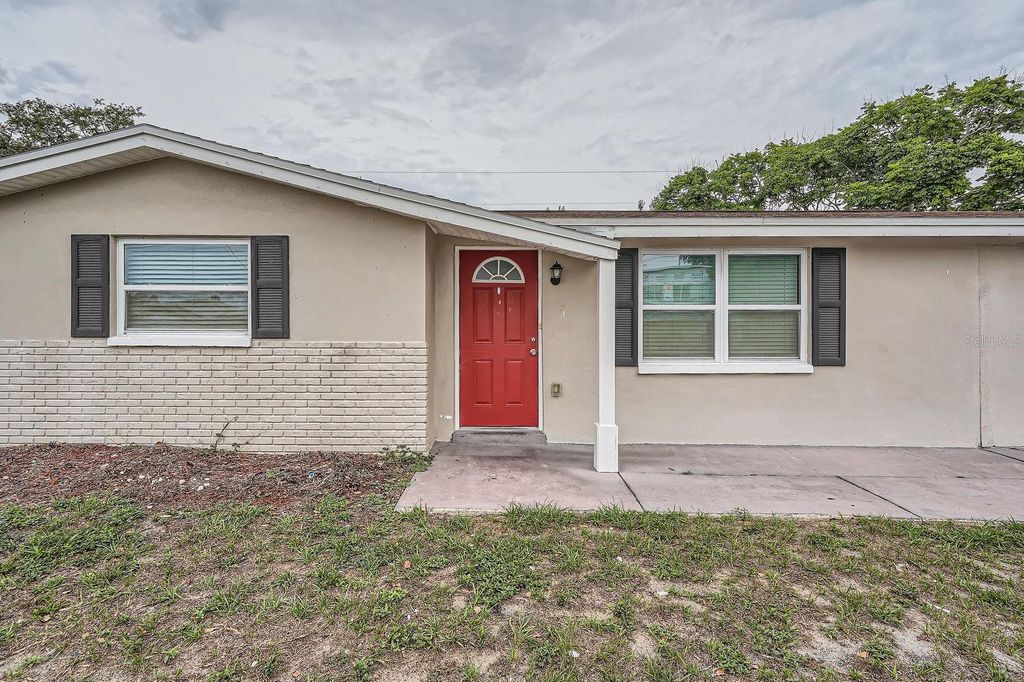 Photo of 5429 Flora Avenue, Holiday, FL 34690 (MLS # O6314390)