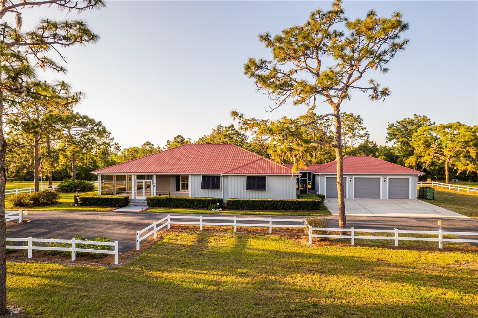 5 ACRES, POOL, METAL ROOF......A CUSTOM HOME YOU MOST LIKELY WON'T SEE ANYWHERE! WRAP-AROUND front porch, full panorama scenes as well as a pool view; SCREENED-IN, OVER-SIZED, recessed lights, & a PINE CEILING. Unique foyer, vaulted ceilings, built-in shelves, dormer glass, CROWN MOLDING, POPLAR TRIM, Amtico vinyl floors, PLANTATION SHUTTERS, foam-insulated walls, & new toilets are bonuses. In the heart of the home is our STUNNING KITCHEN......solid maple cabinets w/ lighting, granite tops, DBL OVENS, COOK-TOP, island, 2 closet pantries, & glass-front upper cabinets. Split-floor plan......Owner's Suite w/ a walk-in closet, access to the pool patio, private bath w/ dual sinks, a tiled shower, a linen closet & cabinet storage. Bdrm 2 has a LONG walk-in closet, Bdrm 3 has dbl closets & French doors, the 2nd bath is HUGE w/ a sit-down vanity & a tiled shower. Our 3rd bath has a CUSTOM CORIAN shower/tub. We also have a built-in desk w/ cabinets....perfect for charging devices or storing the mail. The laundry room has multiple racks, a folding station, vacuum closet, & a floor drain! WATER HEATER REPLACED IN 2023, A/C COPPER LINES ALL RE-PIPED IN 2021 & the unit has an ELECTRIC STATIC DUST FILTER. It has been serviced yearly w/ a recent passing inspection. Outside we have Hardy Board siding & soffit, PVC strips, stacked stone, GUTTERS, lit flag pole, ASPHALT DRIVEWAY, fence/cross fence, a POLE BARN, a covered/screened walkway leading to the 3-CAR GARAGE.....enlarged for 'wiggle room' with two 8' bays & one 10' bay. Our pool utilizes a SALTWATER system, has its own fence & sports a 'volleyball' design. A GENERATOR OUTLET is in place for hook-up due to power outages. We have CUSTOM STORM SHUTTERS & flood lights. The well has a softener system, an aerator, & a charcoal filter. There is a termite-bond in place with annual inspections. The septic was just serviced/pumped......beautiful Oaks, Pines, Holly, & Magnolias adorn the property. This drive is lined with picturesque fencing & offers an addtl parking pad. Location is ideal w/ the FL Turnpike currently 6+ miles away, OIA can be reached within 25+ mi, Lake Nona within 22+ mi, Melbourne Beach within 52+ mi, & the famous attractions are within 33+ mi. St. Cloud offers many lakes for boating/fishing, a downtown w/ shops & eateries, & a sandy beach lakefront park. We have a family-run Mick Farms for your fresh produce & "u-pick" days......w/ such a rare piece, make sure to schedule your private showing quickly.