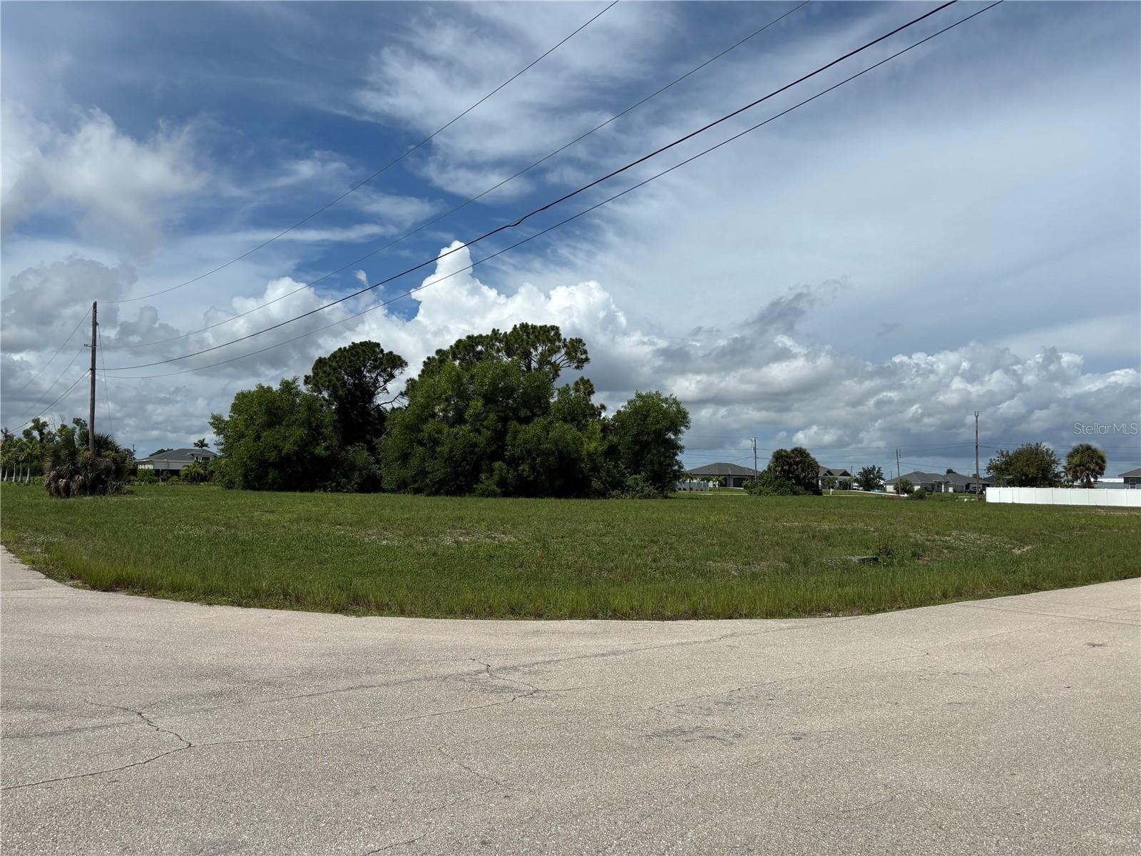 Exceptional Opportunity in Cape Coral! Build your dream home on this stunning vacant lot located in the sought-after Burnt Store area (Bond Star Area) in NW Cape Coral. Positioned in a peaceful and rapidly developing residential neighborhood, this great Lot offers the perfect balance of privacy, nature, and long-term value. Whether you’re looking to build your primary residence, vacation retreat, or make a smart investment, this lot is the ideal canvas.
Residential zoning – ready to build, No HOA restrictions, Paved road with easy access to Burnt Store Road, Utilities nearby (electric and water), Surrounded by new construction and development, Close to marinas, golf courses, schools, and the upcoming Seven Islands project. Wake up each day to the peace and tranquility of this beautiful location. Create a home tailored to your vision while enjoying everything Southwest Florida has for you—sunshine, stunning sunsets, and a vibrant coastal lifestyle. Don’t miss out on this incredible opportunity! Whether you’re an end-user or investor, now is the time to buy land in Cape Coral. Your future starts here!