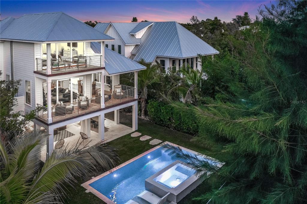 Available May-December with a 90 Day minimum at $15,550 per month plus taxes and fees booked for 2024 season.
Welcome to The Captain's Quarters! This newly built Luxury Rental Home on Longboat Key has everything for you and your family to enjoy your home away from home! This three-story 3-bedroom, 3.5-bath home boasts top of the line features, Smart Home technology, and beautiful décor throughout. As you walk the stone path to the front door, you will find beautifully manicured landscaping in every direction. This home has many luxury details including a gourmet kitchen which, is equipped with all WOLF appliances, SUBZERO refrigerator, wet bar, wine cooler, Spanish porcelain tile floors, quartz countertops, 10' ceilings, custom PGT high impact doors and windows providing plenty of natural lighting and protection from the elements. The ground level bonus room features a wet bar, which includes a refrigerator, ice maker, dishwasher, sink/garbage disposal acting as second kitchen for the guest suite. In addition you will find a custom-built queen murphy bed, a 65” Smart TV, and four comfortable chairs that overlook the stunning pool deck where you will find you and your family spending a lot of time relaxing and making memories. As you make your way to the second level, either by the elevator or the stairs, you are welcomed by an open and airy floor plan. To the right of the staircase is the main large living room that boasts a large plush “L” shape sofa, a cozy swivel day chair, and a 65” Smart TV. Next to the living room is the immaculate dining room, which brings a beautiful coastal element. The dining table can accommodate up to six comfortably. The living room and dining room share a beautiful balcony with views of the pool and all the lush landscaping surrounding this home. There is outdoor seating that can accommodate up to four comfortably. Adjacent to the dining room, you will find the state-of-the-art kitchen where you can prepare all your favorite meals. As you make your way down the hall from you will find the first two bedrooms. The first bedroom has been designed for the kid at heart, and includes three queen-size beds, a 55” Smart TV, and attached private bath. Next door you will find the second bedroom. This room boasts a queen-size bed, a 55” Smart TV, a private bathroom, and balcony. As you head to the top floor, you will find the master suite, which boasts a king-size bed, a 65" Smart TV, and a private deck with seating for two overlooking the pool. This master bathroom is truly one of a kind and includes two separate vanities, an enormous soaking tub, and a walk-in shower! Rinse off in the outdoor shower before heading into the house! This home has everything you and your family will need to make memories that last a lifetime! Enjoy the provided beach and pool essentials, which include beach chairs, a beach wagon, beach floats, and pool floats. This property is available to rent monthly only. Pool and spa heat available for an additional fee. Furry friends welcome. Small dogs only. No cats.
*Taxes and fees not included