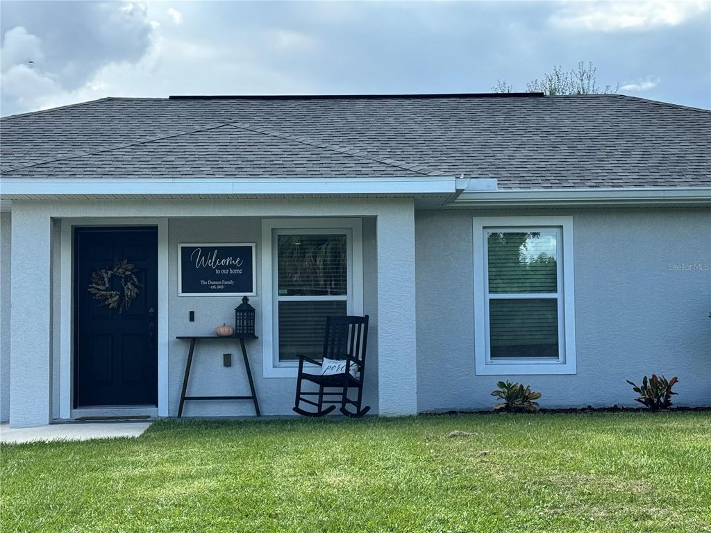 Photo of 207 Fletcher Street, Port Charlotte, FL 33954 (MLS # C7515699)