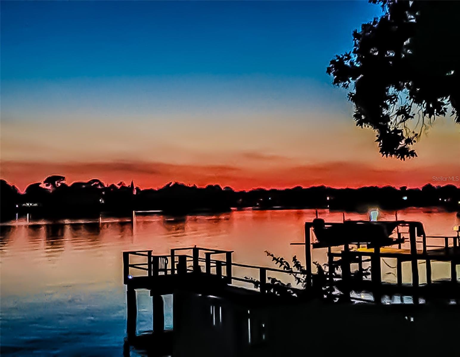 Two-story waterfront home with Gulf Access & Income Potential. Discover this unique waterfront property offering direct Gulf access, beautiful sunsets and a private boat dock, ideally located just minutes from the iconic Sponge Docks, historical landmarks, and the scenic bayou. No recent or past flooding and no flooding during Helene or Milton. This two-story home is a rare find, boasting four bedrooms, three full bathrooms, and ample space for guests, multi-generational living, an in-law suite or space with income-producing potential. The first level features a private kitchenette, two bedrooms, and a full bathroom which has been freshly updated. The second floor offers two additional bedrooms and two full bathrooms. The guest bathroom on the second floor has been freshly updated. The primary suite includes a full private bathroom and private access to the second-floor porch. A spacious living room with serene bayou views, and a cozy wood-burning fireplace are ideal for relaxing evenings while watching the sunset. Enjoy the Florida lifestyle from the comfort of a covered porch on both levels, offering peaceful views of the water and lush surroundings. The home also includes an indoor laundry area. This home is ideally located, offering a private, tranquil and secure waterfront living experience. Don’t miss this incredible opportunity to own a waterfront gem in one of Tarpon Springs’ most desirable locations. Schedule your private showing today!