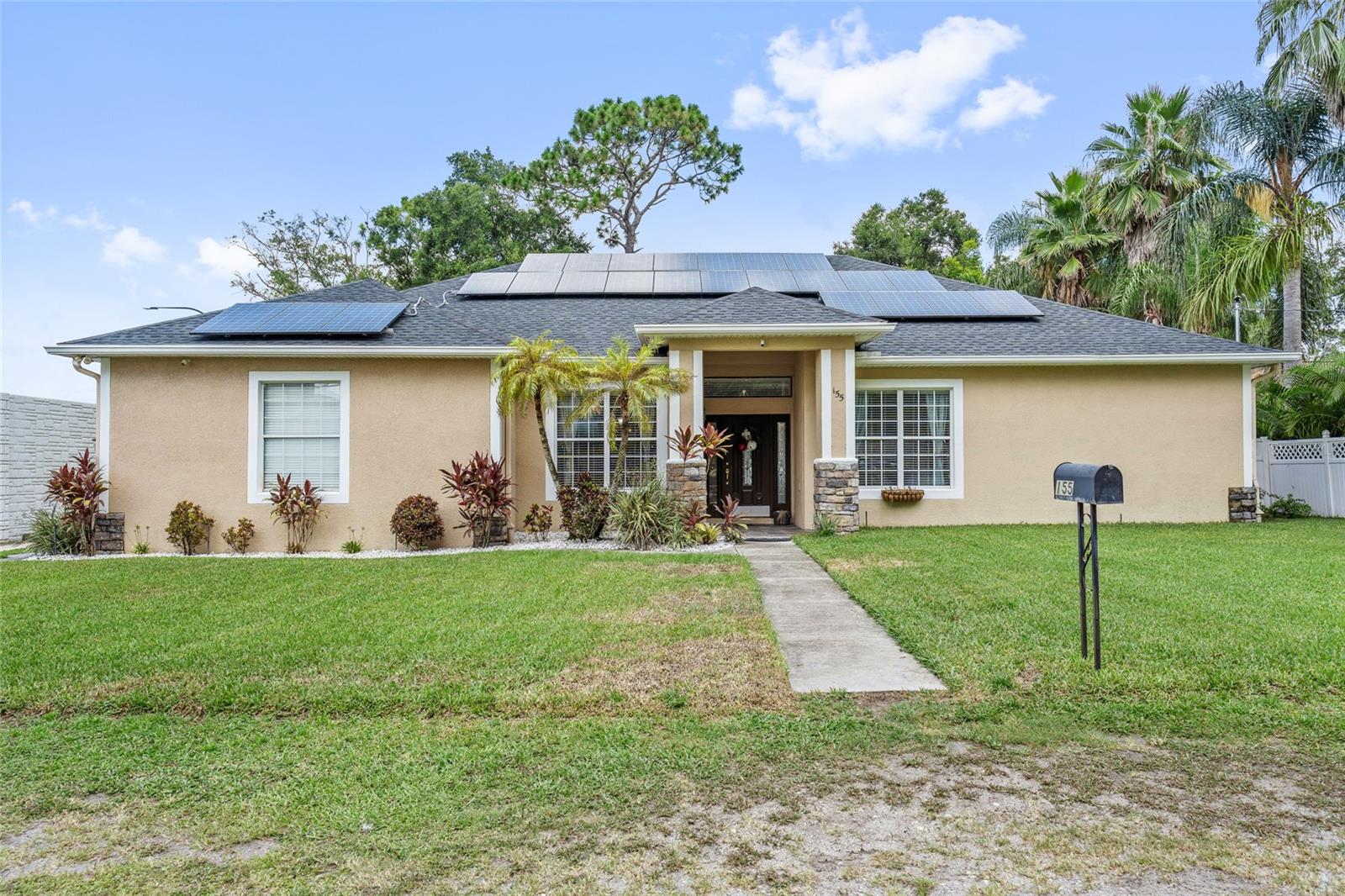 Welcome to 155 Hidden Woods Cove – where this home meets everyday comfort in the heart of Altamonte Springs! This stunning residence boasts new porcelain flooring throughout, recessed lighting highlighting 9+ foot ceilings, and a versatile split-floor plan perfect for both privacy and entertaining. Step into the kitchen, complete with stainless steel appliances, granite countertops, combination wall ovens, ample space for prepping meals and finishes perfect for entertaining. New Ac installed in 2022, reroof 2024, fully paid off water system purifier, assumable energy efficiency solar for ongoing cost savings and sustainability and a laundry room with washer and dryer included! Step outside to an oversized patio—perfect for outdoor dining, entertaining, or simply relaxing in the expansive backyard. The spacious 2-car garage provides ample storage, and the large backyard offers endless possibilities—whether you’re hosting gatherings or enjoying peaceful evenings with family and friends. This home has it all—style, functionality, and an unbeatable location. Schedule your private showing today and prepare to fall in love!