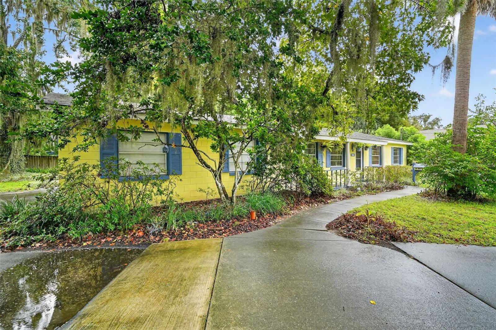 Charming Mount Dora home on .30 acre corner lot with fenced backyard. This property offers inviting curb appeal, circular drive with plenty of parking, mature landscaping, and plenty of outdoor space for entertaining, gardening, or play. The covered from porch welcome you inside where e you will find light-filled living and dining areas with a comfortable layout designed for everyday living. The kitchen has updated cabinets and pass-through window to the large, screened porch. The laundry room is just off the kitchen with built in storage/pantry space and door leading to the garage. The home offers 2 guest bedrooms and guest bathroom has shower with tub. The primary bedroom has ensuite bathroom with walk in shower and vanity with makeup, sit down area. The screened porch overlooks fenced backyard with mature landscape providing privacy ideal for pets, adding a pool, gardening or expanding. Located just minutes from downtown Mount Dora, this home offers convenient access to shopping, dining, parks, and the waterfront. A wonderful opportunity to invest in a home with character and space in one of Central Florida’s most desirable communities.