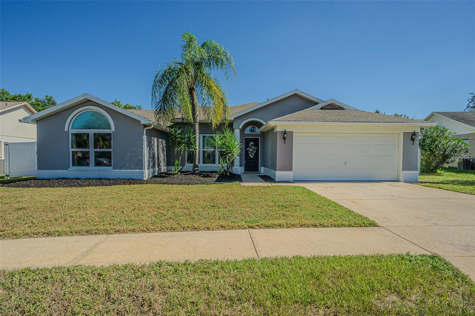 Welcome to this exceptional 3 bedroom, 3.5 bath home featuring a spacious office and a private mother-in-law suite with a full bath and kitchenette (no range). Step inside to an elegant open layout with vaulted ceilings, designer lighting, and a beautifully updated kitchen with open shelving, perfect for entertaining. The living room is large and inviting, offering plenty of space for relaxing and gathering with family. The primary suite opens directly to the pool and includes a spa-inspired bath with a brand-new soaking tub and walk-in shower. Additional bedrooms are spacious and filled with natural light. Outside, enjoy your private resort style saltwater pool, resurfaced just two years ago and overlooking a serene bird preservation area for ultimate privacy. Just a short half mile walk away, Veterans Park offers a new playground and a seasonal splash pad.
Meticulously maintained with numerous upgrades:
• Roof, HVAC, and water heater (4 years old)
• Appliances (2 years old)
• Updated pool equipment and salt system
• Epoxy garage floor, new fence & double gate
• Impact-rated hurricane windows and doors with lifetime warranty
Located in a no flood zone with low HOA fees and scenic walking trails throughout the neighborhood, this home perfectly blends luxury, comfort, and peace of mind. A rare find! Schedule your private showing today.