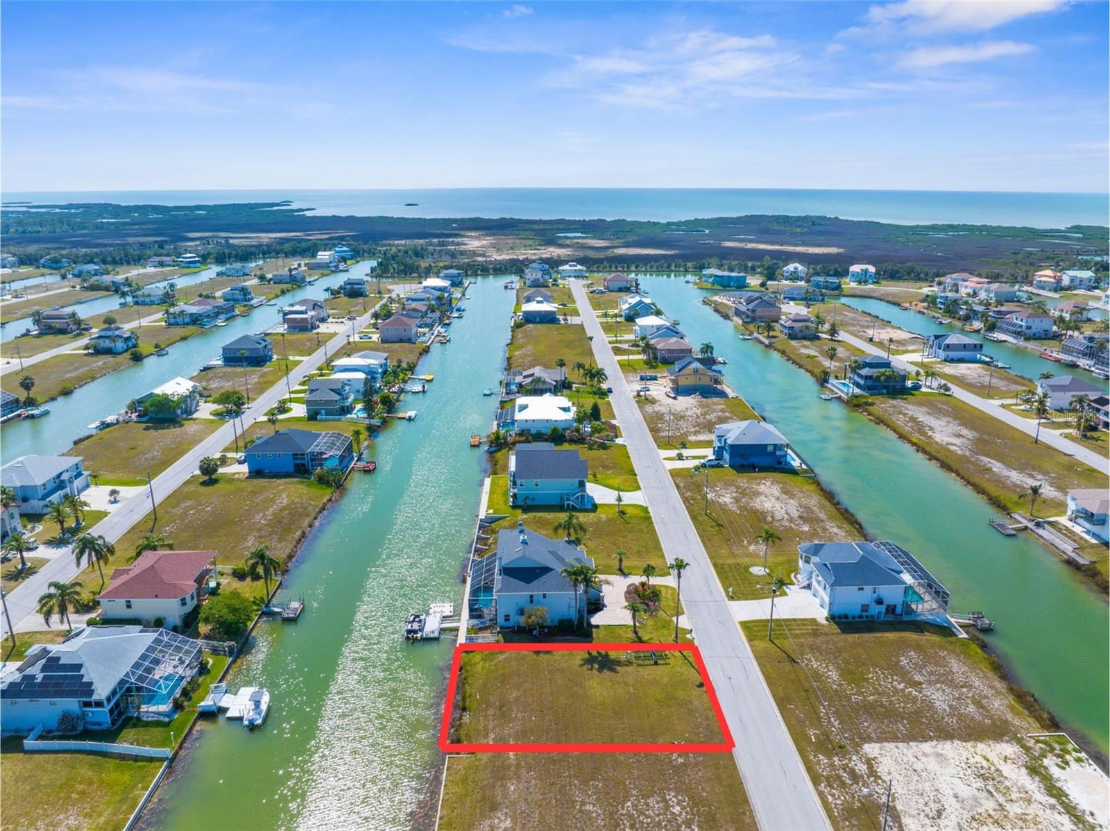 Lot 34 Cobia Drive in Hernando Beach South, Florida, is a 7,500 sq ft residential lot (75 ft x 100 ft) zoned R1C for single-family homes. This waterfront property offers 75 feet of canal frontage with indirect Gulf access via a community boat lift—ideal for boating and kayaking enthusiasts. Located in a quiet, deed-restricted neighborhood with an annual HOA fee of $330, the community maintains vacant lots and offers shared amenities like a boat slip. It's an ideal spot to build your coastal dream home. Just a short drive away, Weeki Wachee Springs State Park offers crystal-clear waters for kayaking, paddleboarding, and manatee spotting. With peaceful surroundings and outdoor adventure at your doorstep, this lot blends the best of Florida waterfront living.