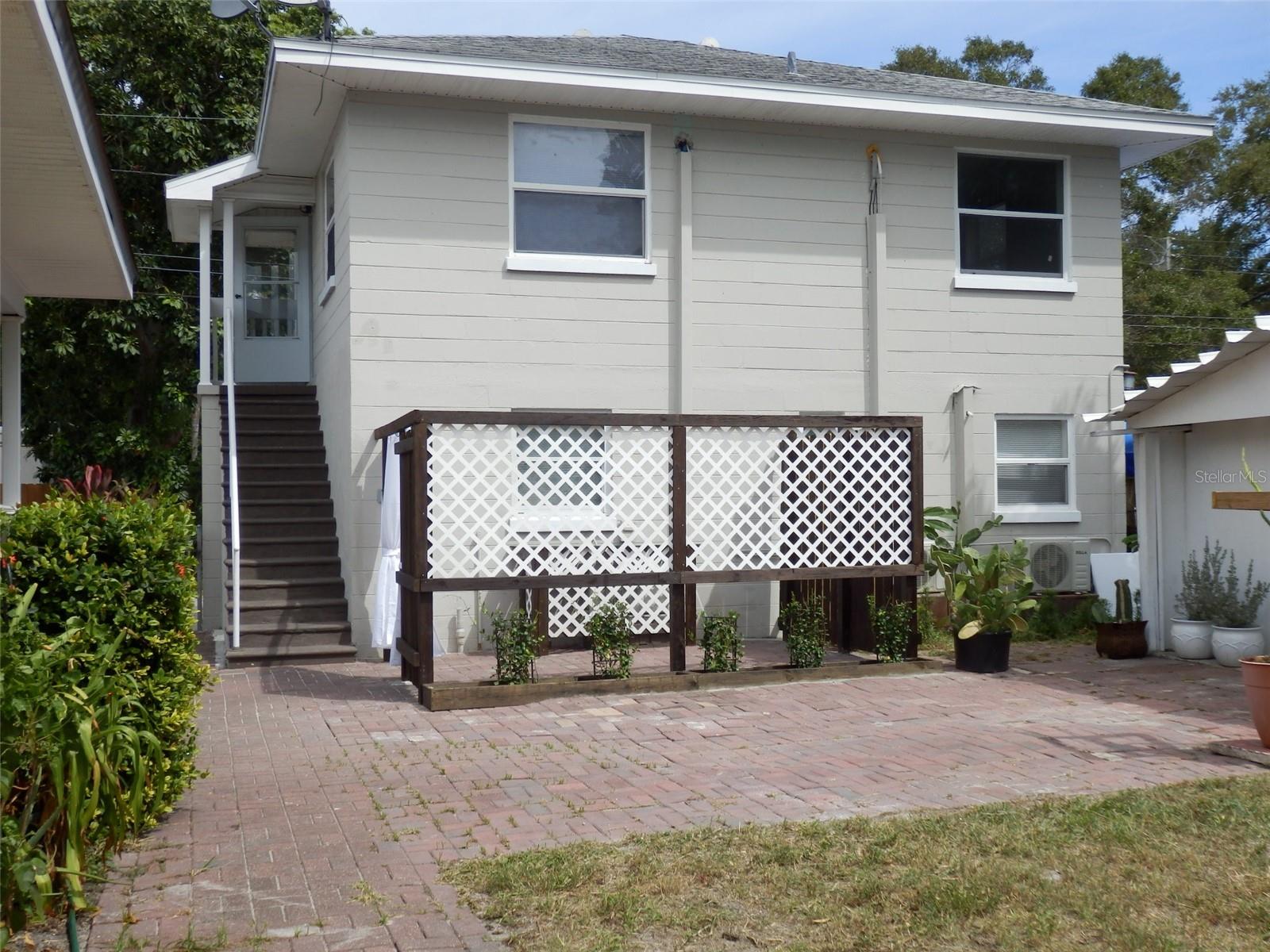 Location !! Location !! Available Now !! Centrally located in St. Petersburg !!! This Garage Apartment ( UPSTAIRS) has 1 Bedroom and 1 bath with an Open Concept Living Room !! 2 Modern Ceiling Fans and 2 Mini Split AC Units!! Kitchen has a Refrig. with Ice Maker, New Microwave, Exhaust fan and Modern Lighting..!! Tall Ceiling in the Bathroom with Tub and Shower !! Lots of Windows for abundant !!! Natural Light $1100 rent PLUS $100 towards the Water, Trash, Sewage and ground Maintenance = Total $1200 monthly !! First Month and Security Deposit.........No Pets....!!! NOT in a Flood Zone and in a high and dry area !! Features a fenced in Yard with a Small Patio and an area to bring a grill !! 2 parking spots available !!. Tenant Screening required. The unit is perfect for someone looking for nearby restaurant's, shopping, public transportation, etc.!! Close to 35 miles of beaches for a Beautiful Sunset !! 10 mins to Treasure Island Beaches and 10 mins to Beautiful Downtown St. Pete !!!