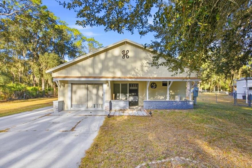 Enjoy serene Florida living just minutes from Lake Rosalie! This unique property sits a short walk from the public lake access and boat docking areas, offering easy access to fishing, boating, sunsets, and outdoor recreation. The original 1974 mobile/manufactured home has been expanded over the years to encompass additional enclosed living areas, creating approximately 1,800 sq ft of functional space (buyer to verify). The home features ceramic flooring, a fireplace, three rooms, and two baths, with abundant space for family or guests. This listing also includes an additional 0.09-acre fenced lot, expanding privacy and usable outdoor area. Property is fenced and conveniently located near shopping, dining, schools, and major roadways. Sold as-is; buyer to verify square footage, permitting, and intended use.