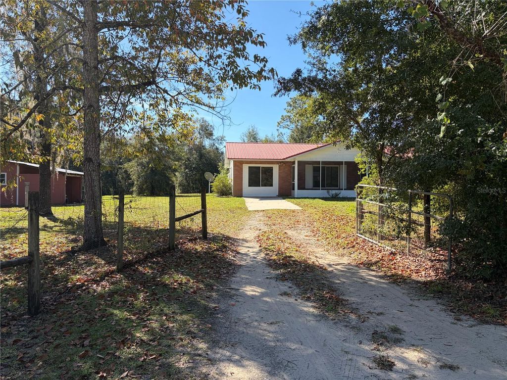 Photo of 10690 NE 100th Lane, Archer, FL 32618 (MLS # TB8440946)