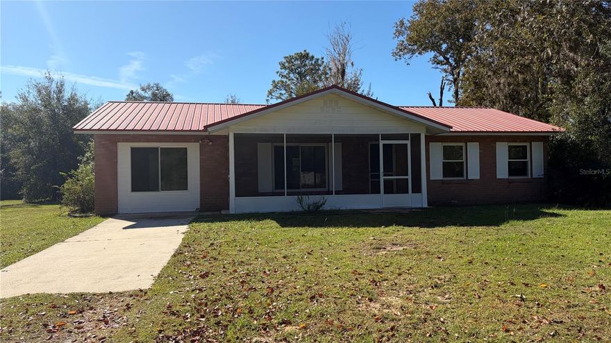 Looking for a peaceful, well-maintained, fully-fenced property with 2.6 acres of privacy? Look no further than this 3 bed/2.5 bath home with Florida room, screened-in front porch, plus large screened-in patio in back with hot tub! In addition, you will find a 16ft x 20ft shed with added space on either side for gardening and for storage, plus an attached carport. This beautiful property even has some blueberry bushes and grapefruit trees for you to enjoy! The metal roof (approx 15 years old) was recently cleaned and looks brand new! New carpet in bedrooms, new interior paint, new exterior paint on house and shed. HVAC 2016. A window a/c unit can be added to the FL room for another 196 sq ft of living space. 19 miles to the University of Florida, Gainesville; 3.5 miles to the center of Bronson. Don't miss out...schedule your showing today!