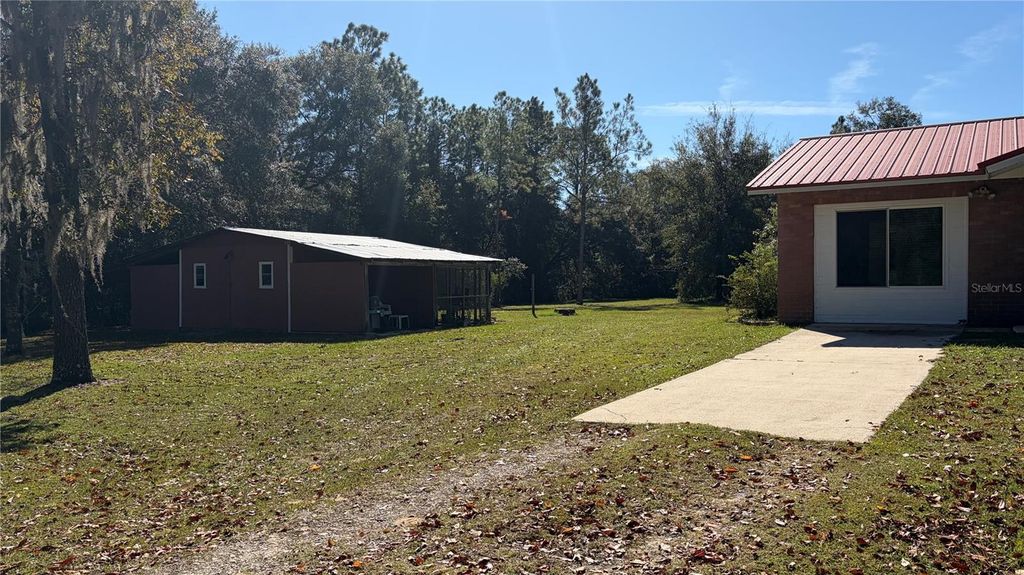 Photo of 10690 NE 100th Lane, Archer, FL 32618 (MLS # TB8440946)