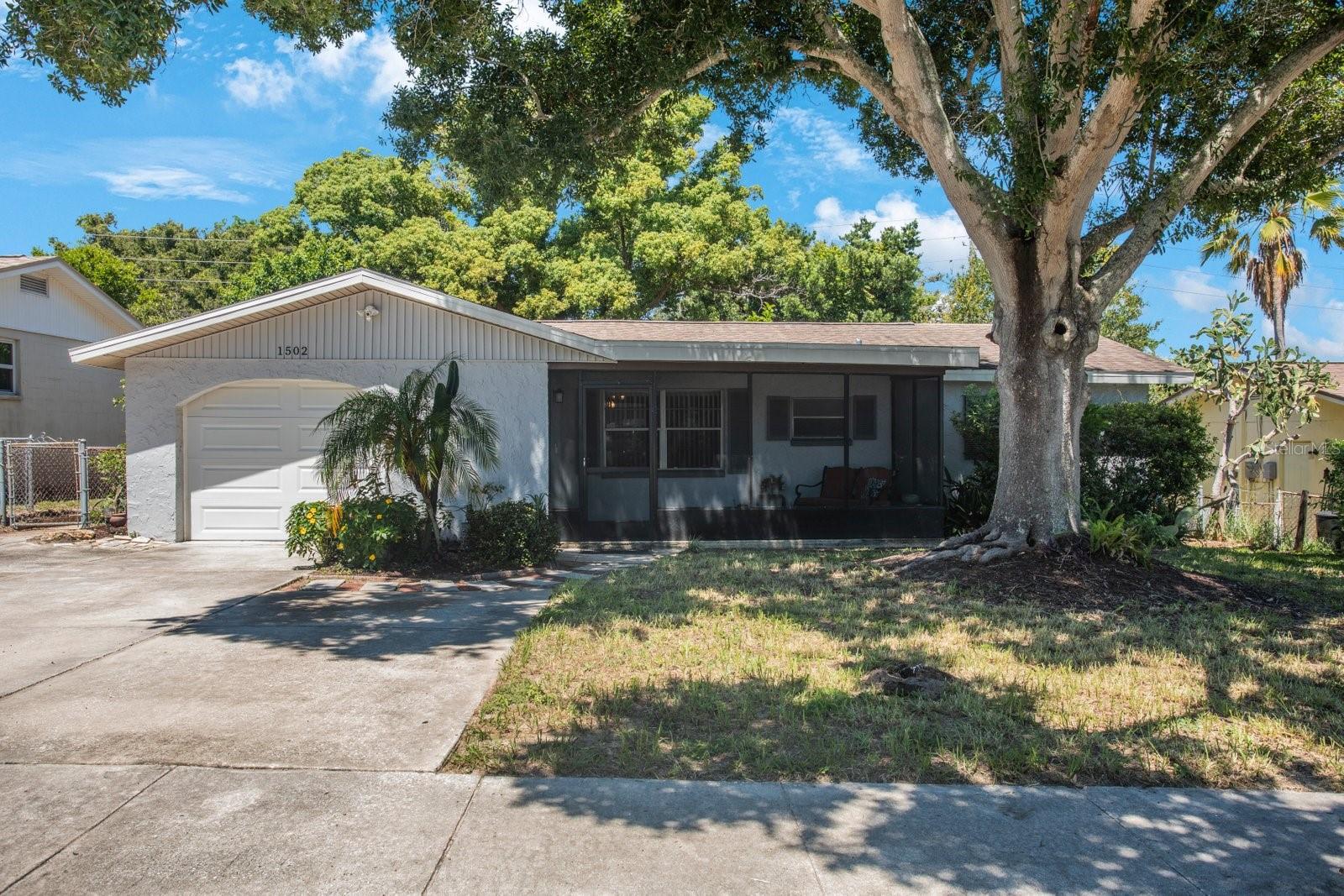 Welcome to this beautifully maintained 3-bedroom, 1-bathroom home located in the vibrant coastal town of Tarpon Springs. Perfectly situated just minutes from the world-famous Sponge Docks, historic downtown, and stunning Gulf beaches, this home has so much to offer! Step inside to discover a bright and open living space with plenty of natural light and neutral paint. The spacious living room flows seamlessly into a cozy dining area and an updated kitchen featuring stainless steel appliances, ample cabinet space, and modern countertops. All three bedrooms are located on the right side of the home are generously sized with plenty of closet space, making it ideal for families, guests, or a home office. The full bathroom is tastefully updated with a contemporary vanity and white tile shower/tub combo. Outside, enjoy a sizable backyard- perfect for entertaining or gardening. There are also screened in patios both in front and back for relaxing in the Florida weather and a storage shed for added convenience. The property includes an oversized driveway for off-street parking and is located in a quiet neighborhood with no HOA. Rest easy knowing this home comes with a clean four-point inspection! Whether you're looking for a first home, a seasonal getaway, or a great investment property, this Tarpon Springs gem is a must-see. Schedule your private tour today!