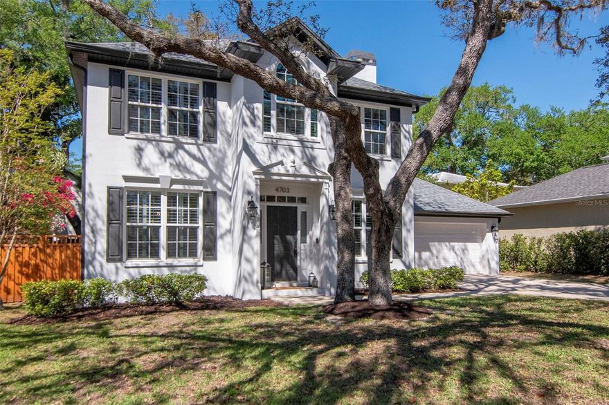 This really is a perfect South Tampa house. All block construction NOT in a flood zone, but on a lovely tree-lined street. It is about a half mile from Bayshore Blvd! Very well maintained and upgraded, this home will provide easy living for years to come. New ROOF in 2023, freshly painted interior, even the light fixtures have all been replaced. The spectacular owners' suite has a nook for reading or a desk. Wood floors throughout the second floor as well as the living and dining areas. The bright kitchen includes a spacious eating space. There is a whole house water filtration system and softener, plus the water heater was new in 2024. In the back of the house is a screened patio, about 320 sq ft! Totally finished and including a fan and skylights, this space is perfect for so many uses. Across the TURFED back yard is a covered hot tub/spa, making it easy to enjoy without regard to the weather. Special features include the  custom built-in bookcase in the living room, toilets with incorporated bidets, under stairs storage, and sleek recessed lighting. The attached two-car garage includes a work bench, plus there is  storage space in the attic. Easy access to Gandy and the Selmon tollway, less than half of a mile to Publix and Target. For the accident prone, the home is less than a quarter mile to TGH Urgent Care.