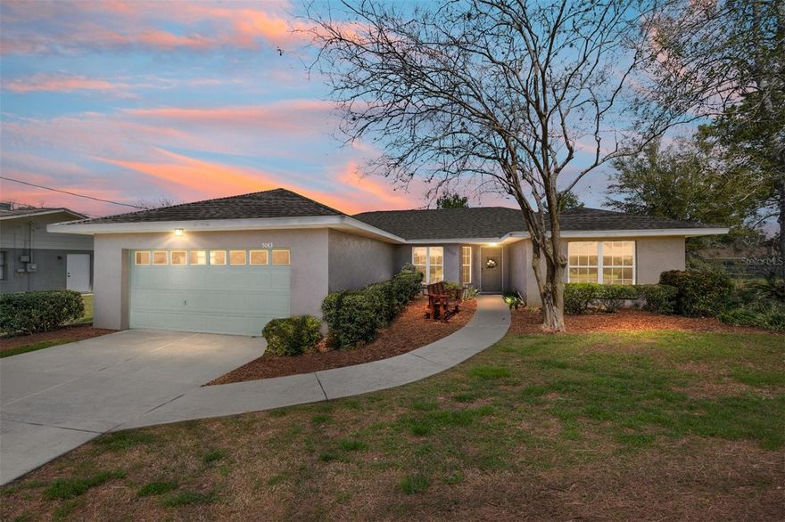 Welcome to this charming and well-maintained 3-bedroom, 2-bath home located in one of Southeast Ocala’s most established and sought-after neighborhoods. Built in 1996 as a former Irvin model home, this property offers thoughtful design, spacious living, and timeless appeal. Step inside to a bright and open living area featuring cathedral ceilings that create an airy, expansive feel, while the bedrooms with higher ceilings for added comfort throughout. The split-bedroom layout provides both privacy and functionality, and the interior laundry room adds everyday convenience. The kitchen and living spaces flow seamlessly, making this home perfect for both relaxing and entertaining. One of the bedrooms has been uniquely converted into a cozy office or workspace, formerly used as a home salon, complete with a sink and mirror area. Real hardwood floors in this room add warmth and character, making it a standout feature of the home.
Outside, enjoy a spacious backyard shaded by mature trees, offering a peaceful, park-like setting. The patio area includes a built-in grill and firepit—perfect for gatherings or quiet evenings at home. A like-new shed (2023) provides additional storage, and the extra-wide driveway allows for ample parking. Ideally located near schools, shopping, restaurants, parks, and medical facilities, this home combines comfort, convenience, and location in one wonderful package. Roof (2020), HVAC (2017), LVP Flooring in kitchen and foyer (2025), Exterior stucco and paint (2025).