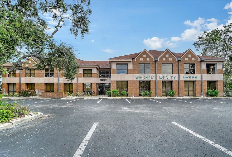 SVN Commercial Advisory Group is very pleased to present the Wildewood Office Park for purchase. This beautiful, peaceful 11-building office park sits on 9.2 +/- Acres in central Bradenton, Florida between Lakewood Ranch and the Gulf beaches.  The 11 buildings create 82,248 +/- Square Feet of professional and medical office space, in a park-like setting of mature oak trees. 
The park consists of the front signature two-story office building located directly on heavily trafficked Cortez Road which is a major arterial roadway. It’s prominence, visibility and brick facade create the feeling that you have arrived at your office park. It has a two-story grand lobby area that has been recently refurbished and provides a gathering place and feeling of community.
The other ten office buildings in the park are all one-story, but carry through with the same brick and wood trim design as the signature building, and they range in size from 4,855 to 5,762 +/- square feet each.  Having separate buildings with multiple entrances provide tenants with easy parking to their suite as well as their own outside entrance in most cases.
The front signature building as well as eight of the remining buildings all sit on their own parcel of land allowing them to be sold individually.  Only two buildings; 3659 & 3661 Cortez Road share a parcel and would need to remain together. All of the owner’s association documents have been recently updated to provide for individual building sales if desired. The park features two pylon signs on Cortez Road for ample visibility and increased tenant attraction, as well as a source of additional income.
The current  owners have have always completed needed maintenance in a timely manner including a recent new drive isle behind the signature building, and four of the smaller buildings receiving new roofs in the past two years.  An active and professional third-party property manager and leasing team will provide a smooth transition upon closing. 
This value-add property’s potential lies in the opportunity to continue renovating and updating buildings and increasing rents as tenants turn over. Having many small suite options, and a gross lease structure are very attractive to local small businesses, and these smaller units are always in demand. Another option is conversion to medical office spaces to serve the continued aging population, and physicians from the nearby Manatee Memorial Hospital and HCA Florida Blake Hospital. 
Cortez Road, also known as 44th Avenue, is one of only three major east-west corridors in Bradenton offering easy transit from Lakewood Ranch east of Interstate 75 to Anna Maria Island’s award winning beaches. It has a daily traffic count of 31,500 cars per day which is expected to increase with the newly completed extension over I-75 and into Lakewood Ranch. 
Rapid development in this area over the last few years has transitioned the West Bradenton Submarket into a well established and upscale area featuring a number of national retailers and high-end residential developments. Wildewood Professional Park is only two miles away from the nationally recognized IMG Academy sports training facility, and only 3 miles away from the incredible 1,200 acre mixed-use development of SeaFlower.