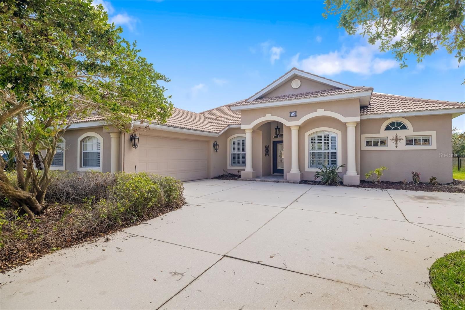 Welcome to 244 Dove Trail inviting 3-bedroom plus office, 2-bath pool home nestled in the heart of the highly desirable, gated community of Greyhawk Landing. Situated on an oversized lot, this home blends comfort, functionality, and Florida elegance. Step inside and be greeted by a spacious open floor plan with soaring tray ceilings, crown molding, and rich wood-style luxury vinyl flooring throughout the main living areas. The heart of the home—the beautifully appointed kitchen with a cozy dining nook. A thoughtfully designed layout creates a seamless flow that’s perfect for everyday living and entertaining. The generously sized primary suite includes a walk-in closet and an en-suite bath with dual vanities, a soaking tub, and a walk-in shower. Two additional bedrooms, a versatile home office, den with built-ins, and a full guest bath provide ample space for family or guests. Step outside to your private oasis where a screened-in pool and spa await, surrounded by lush landscaping and a peaceful preserve backdrop. The lanai with built-in grill is ideal for alfresco dining or relaxing poolside with a good book. Additional highlights include a spacious two-car garage with room to accommodate a third vehicle or extra storage, plantation shutters throughout, and solar panels. This home is just moments from all the exceptional amenities Greyhawk Landing is known for—two resort-style pools, fitness center, tennis and basketball courts, playgrounds, miles of nature trails, and a fishing pier. With a low HOA of just $75/year, this home truly offers an unbeatable combination of lifestyle and value. Don’t miss your opportunity, schedule your private showing today!
