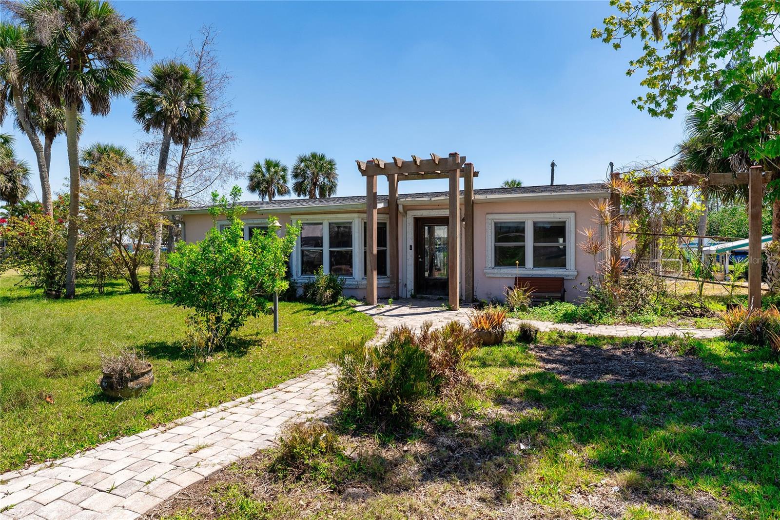 Yes! Seller financing is available! WATERFRONT with 136 Feet of Canal Frontage! Calling all dreamers, doers, and savvy investors! This is your moment. Welcome to your blank canvas on the beautiful Myakka River, just 5 minutes from Downtown Wellen Park and yes, it’s got the bones, the lot, the location, and the potential to be a showstopper. Sitting proudly on TWO lots with 136 feet of waterfront, this property comes with a pool, boat house, a detached double garage, and even extra paver parking for your toys RV, boat, golf cart, you name it. Yes, the home experienced water damage during Hurricane Milton (we’re keeping it real), but that’s exactly why it’s priced to MOVE. It’s the kind of opportunity you don’t scroll past a place to pour in your creativity and make magic happen. Whether you’re looking to flip, rent, or design your ultimate Florida waterfront escape, this is it. The location, the lot, and the lifestyle are unmatched. Own the view. Own the dream. This isn’t just a house, it’s your next adventure.