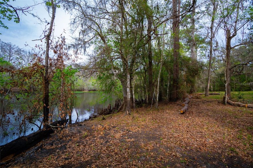 Nestled on a stunning almost 21-acre corner parcel, this unique property offers breathtaking waterfront views of the Withlacoochee River, presenting endless possibilities for its new owner. Whether you're envisioning a serene family home, a thriving mobile home park, or a charming Airbnb camp retreat, this expansive lot provides the perfect canvas to bring your vision to life. Surrounded by the tranquil beauty of the Withlacoochee Forest, nature lovers will revel in the abundance of wildlife, creating an idyllic setting for fishing, hiking, and camping right in your own backyard.

The property is conveniently located just 10 minutes from town, while a gas station and retail store are directly across the street for added convenience. For those seeking access to larger cities, Ocala and Tampa are only 35 minutes away, offering a perfect balance of seclusion and accessibility. Let your imagination run wild as you turn this waterfront gem into a dream retreat, business venture, or private sanctuary.