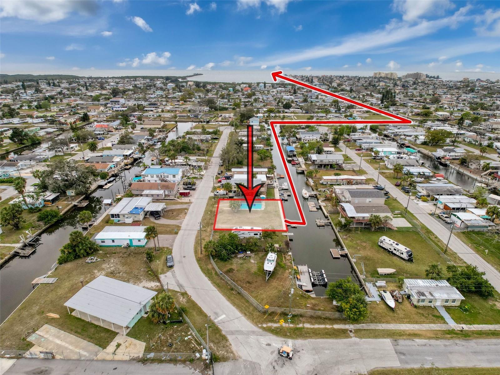 This COMPLETELY FENCED-IN WATERFRONT DOUBLE LOT is located in the VISTA DEL MAR SUBDIVISION featuring 80ft of NEWER SEAWALL (2019) with a 4ft TOP WALK, a 8 x 15ft FLOATING DOCK and a 576 square foot Structure with BATH. There is also WATER, SEWER and ELECTRIC on PROPERTY. All of your local restaurants like INN ON THE GULF, SAM'S BEACH BAR, OLLIE"S ON THE BEACH and GET HOOK are a 5 minute drive. HOSPITALS & SHOPPING as well. The TAMPA BAY AIRPORT, TAMPA BAY, CLEARWATER BEACH, HOMMOSSA SPRINGS, TARPON SPRINGS, PINE ISLAND, HONEYMOON ISLAND and WEEKI WACHEE are approximately 1 hour away. Build your DREAM HOME. FISH & CRAB off your own dock or take a KAYAK, JET SKI or BOAT RIDE to the GULF OF MEXICO where the FISH ARE PLENTIFUL, the FUN is NEVER ENDING and the SUNSETS are ALWAYS AWESOME!