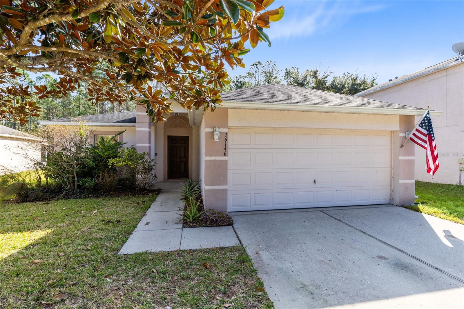 You’ll love this 3-bedroom, 2-bathroom home overlooking a tranquil wooded conservation view from your large screened lanai. The home islocated in the quiet Corner Lakes Estate community of East Orlando. The roof was installed in 2018, a new air conditioning unit in 2023, and agarage door in 2024. This charming one-story home is move-in ready! Featuring rich warm wood style laminate, clean fresh carpet, and ceramictiles add to the warmth of this home. The functional kitchen has heaps of cabinets for storage and features generous counter space, a breakfastbar with an outlook through the family room, and onto the covered and screened back patio. The master bedroom features a large master bathwith an oversized garden tub and separate shower and a generous walk-in closet. Two secondary rooms have a full-sized secondary bathroom.You’ll love entertaining friends and family on your back patio that’s screened, covered, and overlooks your fenced yard with conservation views.