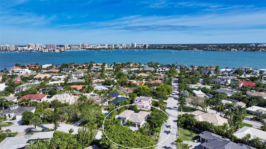 Welcome to the highly sought-after island of Bird Key! Don’t miss this opportunity to secure your spot in paradise with this custom home completed in 2022, crafted by award-winning Allegra Homes. This masterpiece boasts 3 bedrooms, 3 and ½ bathrooms, a 3-car garage, heated saltwater pool and spa, plus a private office and a bonus room, all sitting on .31 acres of beautifully landscaped grounds with privacy fencing. Step into luxury as you enter this stately residence adorned with luxurious wood floors, high-impact windows, solid core doors, window treatments, a whole-house speaker system, designer light fixtures, neutral finishes, and more. This home is being offered fully furnished, filled with hand-picked high-end pieces. As you walk through the front door you are met with the light-filled, open floorplan boasting 16’ ceilings, clerestory windows, and 10’ glass sliders allowing a seamless connecting indoor-outdoor Florida living. In the heart of the home, you’ll find the custom designed kitchen featuring a 5’ x 9’ cooking island, high-end appliances, quartz counters, cabinetry lighting, and a walk-in pantry. Retreat to the luxurious primary suite, tucked away in its private wing of the home, with exclusive access to the back patio, his-and-hers walk-in closets, and a pristine primary bathroom complete with white Carrara marble flooring, a frameless glass walk-in shower, a stand-alone soaking tub, and a stunning vanity with his-and-hers sinks. The Northwest wing houses the private office with custom built-in cabinets, and an exquisite powder bath, boasting designer wallpaper and a high-end chandelier. On the opposite side of the home, you’ll find two guest bedrooms both offering convenient accommodations with en-suite bathrooms, and an additional den/bonus room with full-wall 10’ glass sliders creating an open-air ambiance to the pool and patio.  The backyard oasis sets the perfect setting for entertaining guests or basking in relaxation, complete with a heated saltwater pool and spa, outdoor shower, full outdoor kitchen, covered patio space with a TV, and automated lanai screens. The location of this home is unparalleled, placing you centrally located to the delectable dining and vibrant nightlife of downtown Sarasota, walking distance to Bird Key Yacht Club, and minutes from the white sands of Lido Beach and the attractions at St. Armands Circle. Indulge in this opportunity to call this Bird Key masterpiece home – an epitome of luxury living in a coveted Sarasota locale.