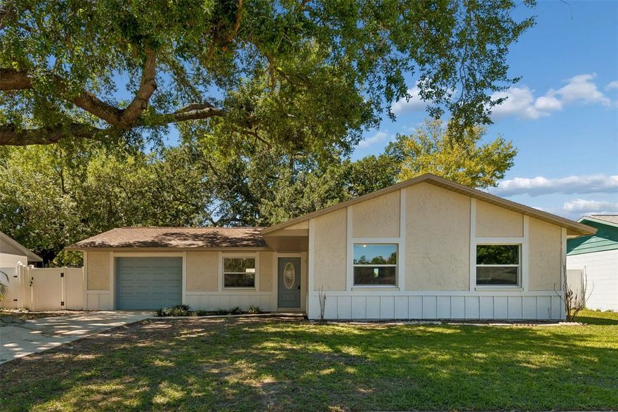 One or more photo(s) has been virtually staged. MOVE-IN READY GEM!  Nestled under the shade of beautiful mature oak trees, this beautifully updated 3-bedroom,  2 bath home offers comfort, style, and functionality in the heart of Seffner.
Step inside to a light and inviting interior featuring brand-new flooring throughout and a fresh, neutral color palette. The spacious living area flows seamlessly into the dining space, creating the perfect setting for both everyday living and entertaining.
The kitchen has been thoughtfully updated with modern white cabinetry, sleek countertops, and newer stainless-steel appliances—designed to impress while offering everyday practicality. Additional upgrades throughout the home include refreshed lighting, updated interior doors, and stylish finishes that enhance the overall look and feel.
The bedrooms are generously sized, offering flexibility for family, guests, or a home office. The bathroom has been tastefully renovated with updated fixtures and a clean, modern design.
Step outside to a huge backyard with endless possibilities—perfect for pets, play, gardening, or creating your own outdoor oasis. The extended patio area is ideal for relaxing or hosting gatherings. Additional improvements such as updated exterior features and a newer garage door add to the home’s overall value and curb appeal.
Conveniently located near shopping, dining, and major roadways, this home offers easy access to Tampa while maintaining a peaceful neighborhood feel.
Don’t miss your opportunity to own this beautifully updated home—schedule your private showing today!