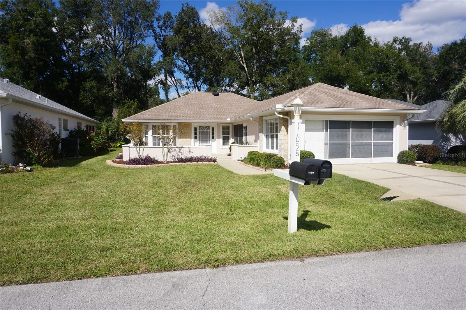 GREAT BONES! GREAT LOCATION! GREAT PRICE! Ask yourself where can you buy a CLEAN MOVE IN READY, CONCRETE BLOCK HOME, with a 2018 Roof, 2015 AC that has been meticulously cared for, in a community that offers 6 pools, 5 hot tubs, GOLF COURSE, Restaurant, 2 Fitness Centers, tennis, pickleball, library, card room, billiards room, DOG PARK, lots of clubs, lots of events and close to Walmart, Shopping, Restaurants, Medical Facilities and more FOR UNDER $200,000!!?? This is a MAINTAINED LOT and Service fees include water for the lawn and lawn care too! The Golf Course, Restaurant, Pool, Hot tub and Auditorium are a short stroll down the street. The neighborhood is one of the prettiest in this subdivision. This home has been loved by its former owner. You have the best of all worlds - an enclosed Florida Room with AC, a Screened Lanai to enjoy the fresh cool air in the Fall, Winter and Spring, and a blank canvas to make it your own! So don't wait - come see me - I'm priced to sell and I need someone now to love me as much as my owner did!