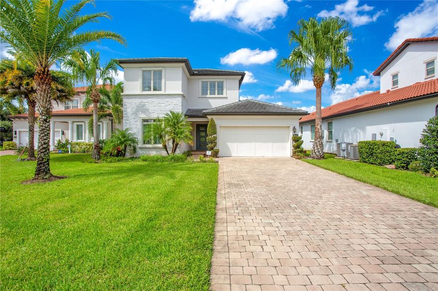 One or more photo(s) has been virtually staged. Welcome to Royal Cypress Preserve, the place where serenity meets luxury! This beautiful modern style Toll Brothers home is situated just minutes from the famed Restaurant Row, Walt Disney World Orlando, and Universal Studios with convenient interstate access to I-4, the 525, the 429 and the 408. Nestled behind the manned guard gates of Royal Cypress Preserve sits this exquisite home with a functional layout and numerous upgrades. This Massiano Tuscan floor plan features 4 bedrooms plus a BONUS LOFT, 3.5 bathrooms, a loft space perfect for a home office, secondary living space or playroom, designer lighting and fixtures throughout, and an open floor plan perfect for entertaining. This home has unmatched natural light, stunning solid wood & porcelain tile flooring, a gourmet kitchen with upgraded cabinetry, lighting and a gas range. There is no shortage of designer touches with high end stone, stainless steel appliances, tons of indoor storage with custom built-ins, and so much more. The primary suite embodies serenity and functionality boasting his and hers walk-in closets, dual vanities set in granite, and a walk-in shower and soaking tub that invites you to relax after a long day. Royal Cypress Preserve is a private, quiet, and guard gated neighborhood of just over 200 homes that offers more than meets the eye. Featuring a Resort Style Clubhouse with a zero entry sparkling pool, a state of the art fitness center overlooking the pristine 124 acre South Lake, a community boat dock that showcases Disney Fireworks nightly, a park and dog park, and an entertaining space like no other. In addition to the luxury provided in Royal Cypress Preserve life here is designed to be stress free with even your lawn maintenance included in the HOA. Enjoy life, luxury and stress free living by making this home yours today!