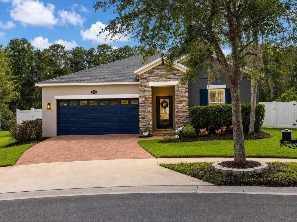 Photo of 19311 Prairie Tree Place, Tampa, FL 33647 (MLS # O6426043)